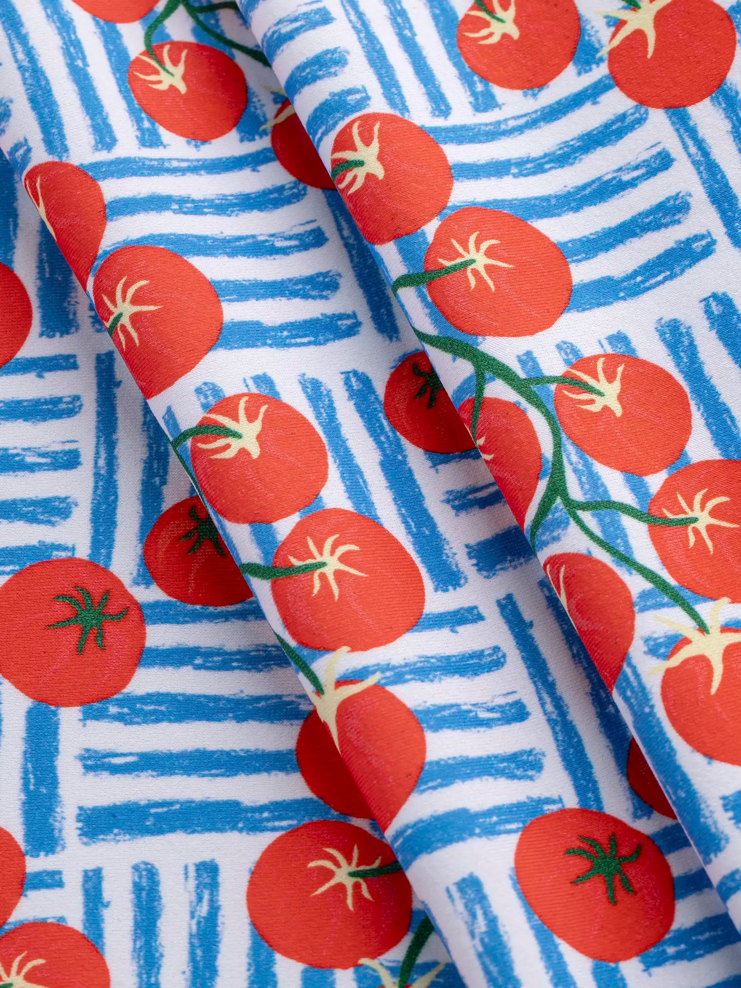 F-NYL024-Caprese-Tomato-Print-Swim-Performance-Knit-Red-Blue-and-White-Core-Fabrics-fold.webp