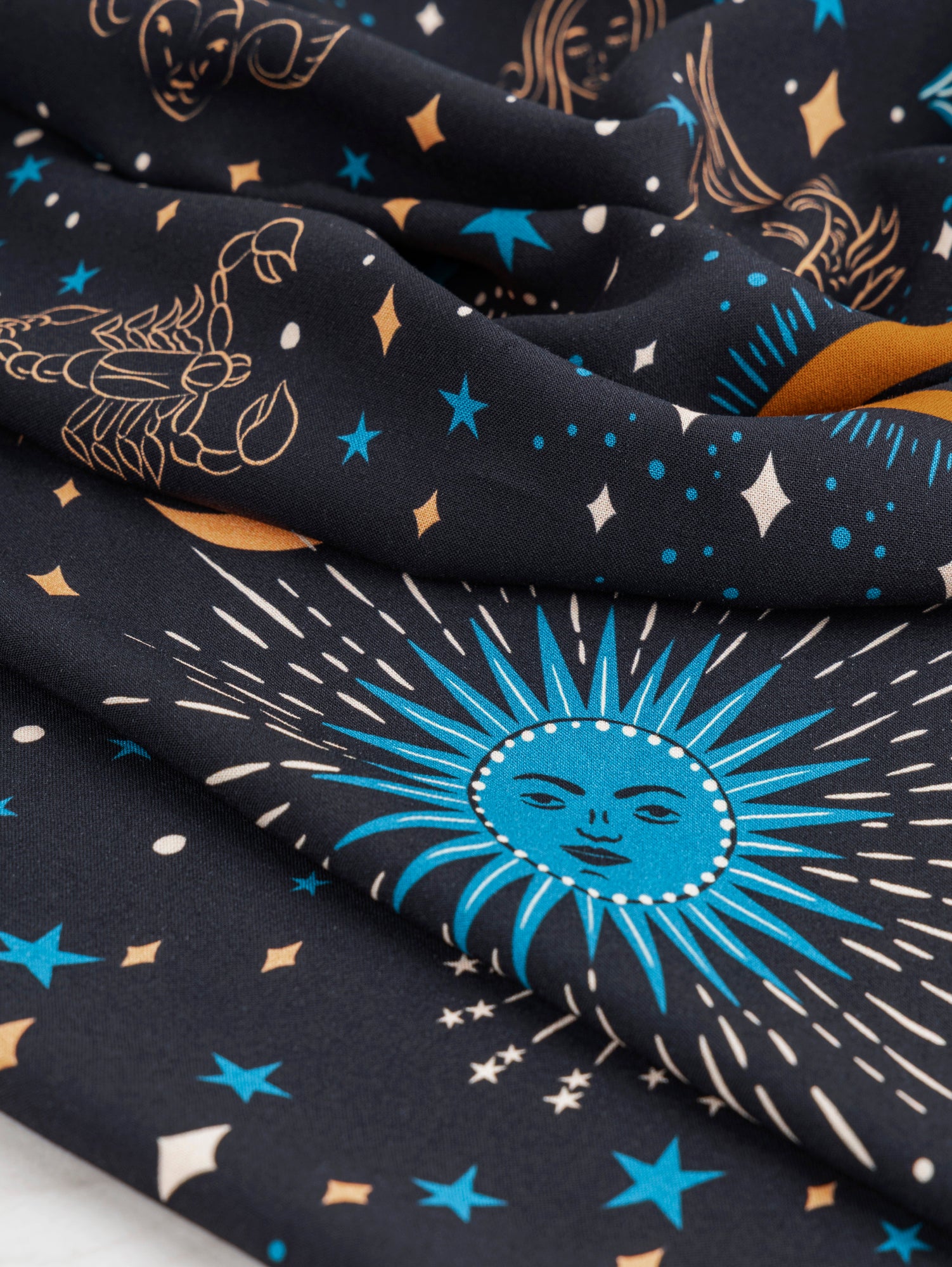 F-VIS229-Celestial-Zodiac-Print-Ecovero-Viscose-Black-Blue-Cream-Ochre-Core-Fabrics-scrunched