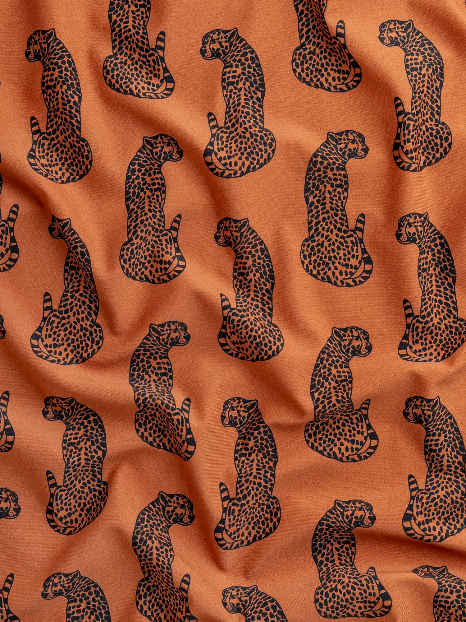 F-NYL025-Cheetah-the-Heat-Print-Swim-Performance-Knit-Terracotta-and-Black-Core-Fabrics-scrunched.webp