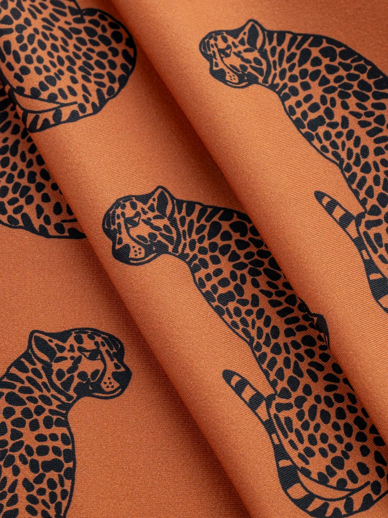 F-NYL025-Cheetah-the-Heat-Print-Swim-Performance-Knit-Terracotta-and-Black-Core-Fabrics-fold.webp