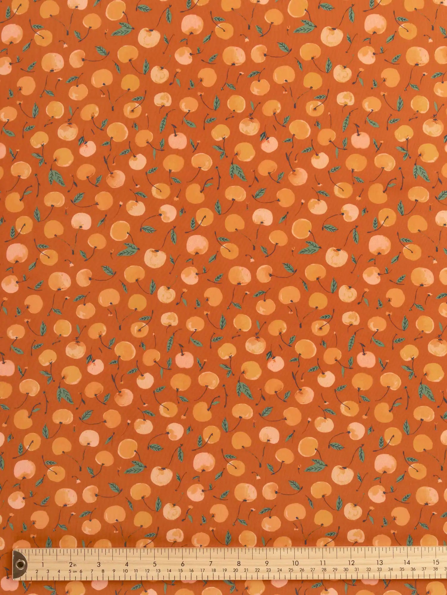 F-DEA237-Cherry-Print-Modal-Challis-Deadstock-Terracotta-Apricot-and-Basil-Core-Fabrics-ruler.webp