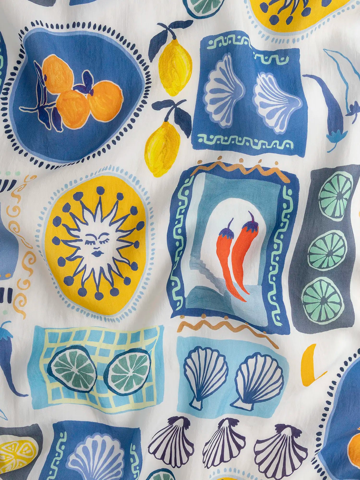 F-TEN019-Citrus-Hot-Pepper-Print-Lyocell-White-Blue-Orange-and-Yellow-Core-Fabrics-scrunched.webp