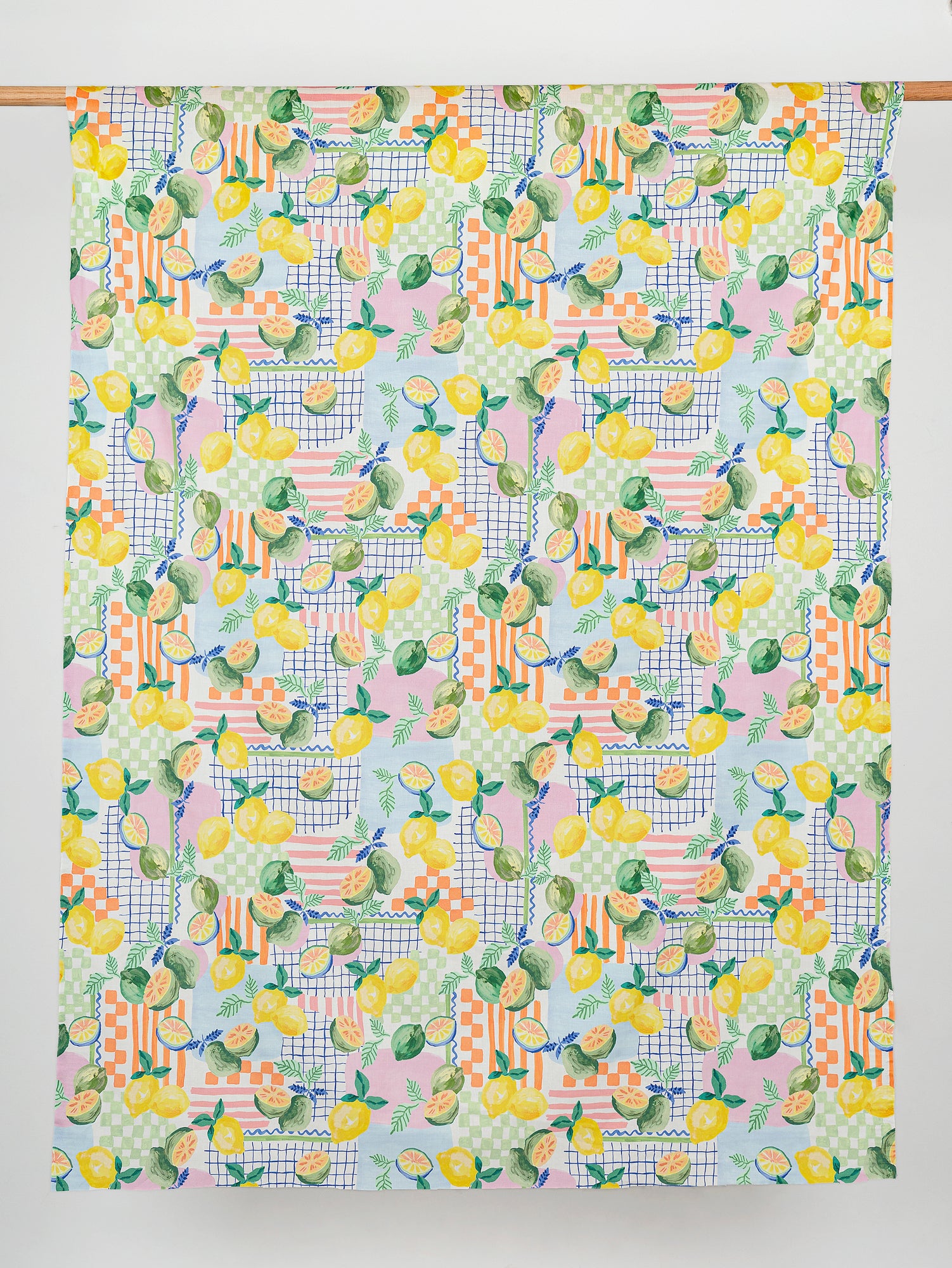 F-COT345-Citrus-Picnic-Print-Cotton-Voile-White-Green-and-Yellow-Core-Fabrics-draped.JPG