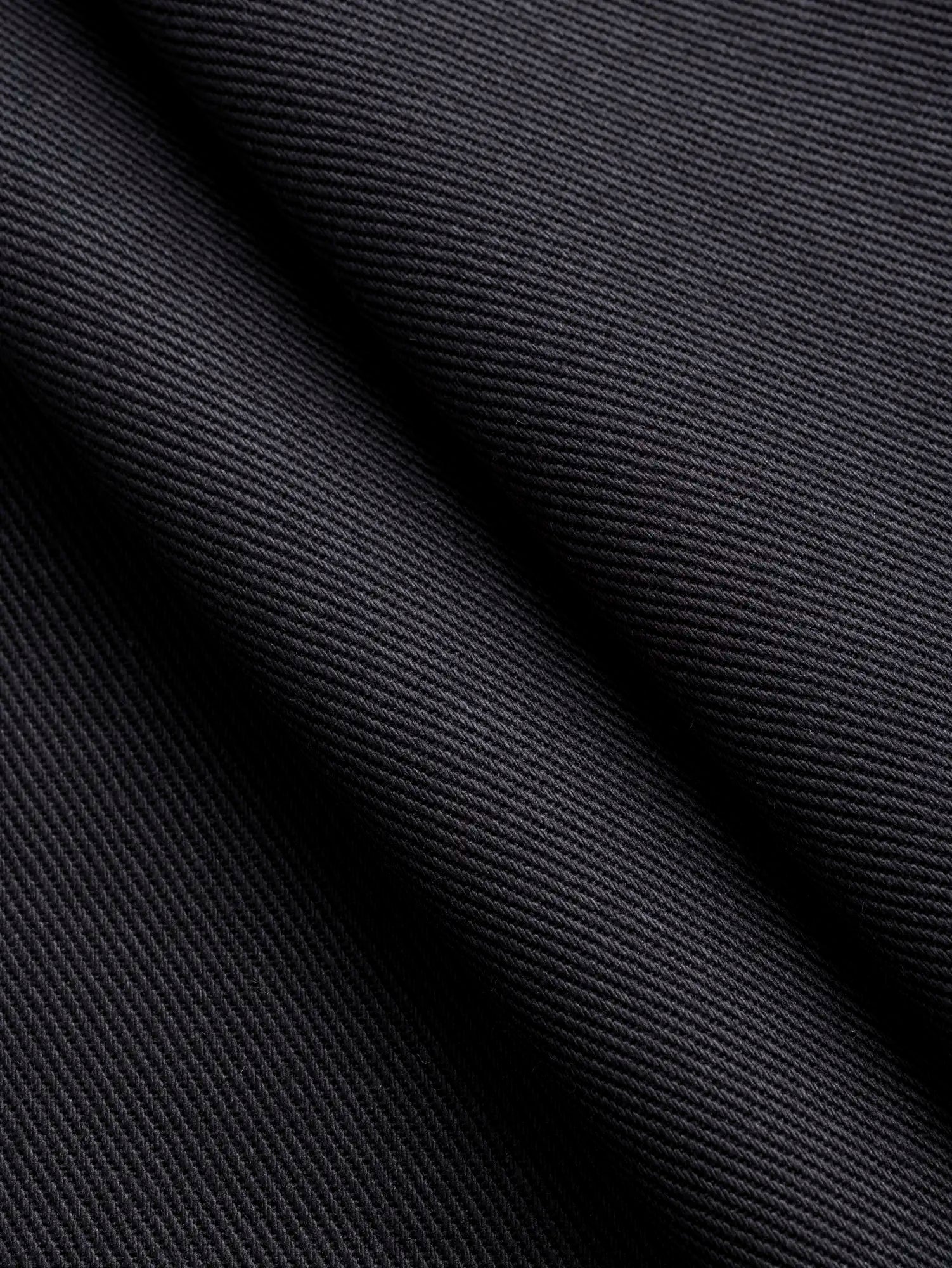 F-COT483-001-Classic-Non-Stretch-Cotton-Twill-Black-Core-Fabrics-fold.webp