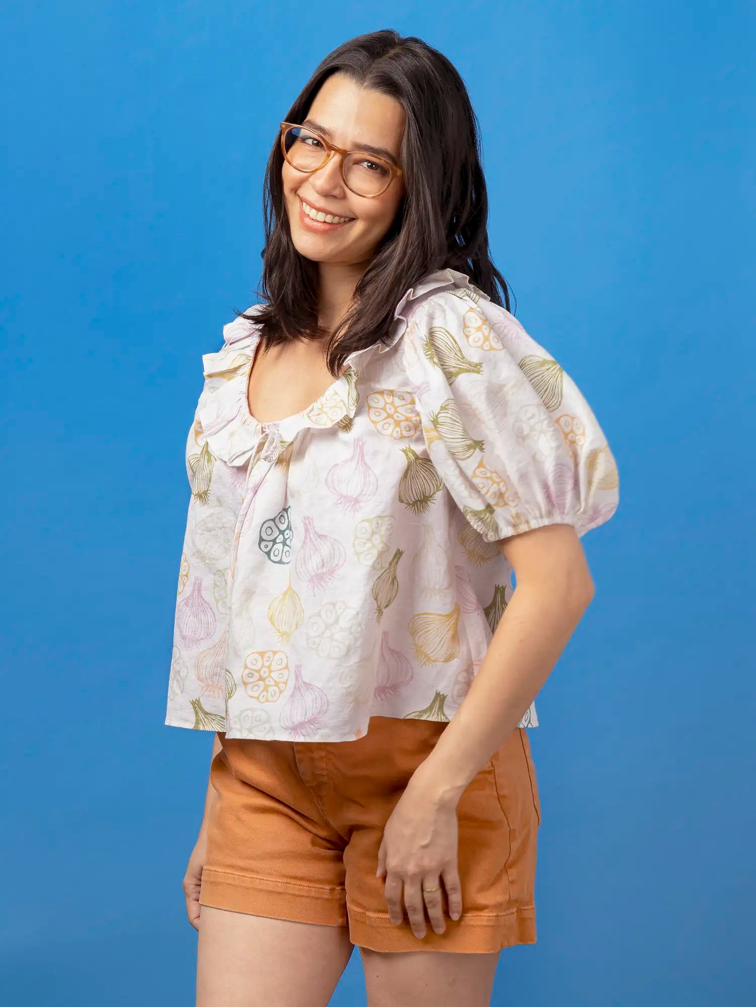 F-COT468-Clove-Story-Print-Organic-Cotton-Linen-Ivory-Sage-Mustard-and-Lilac-Core-Fabrics-model.webp
