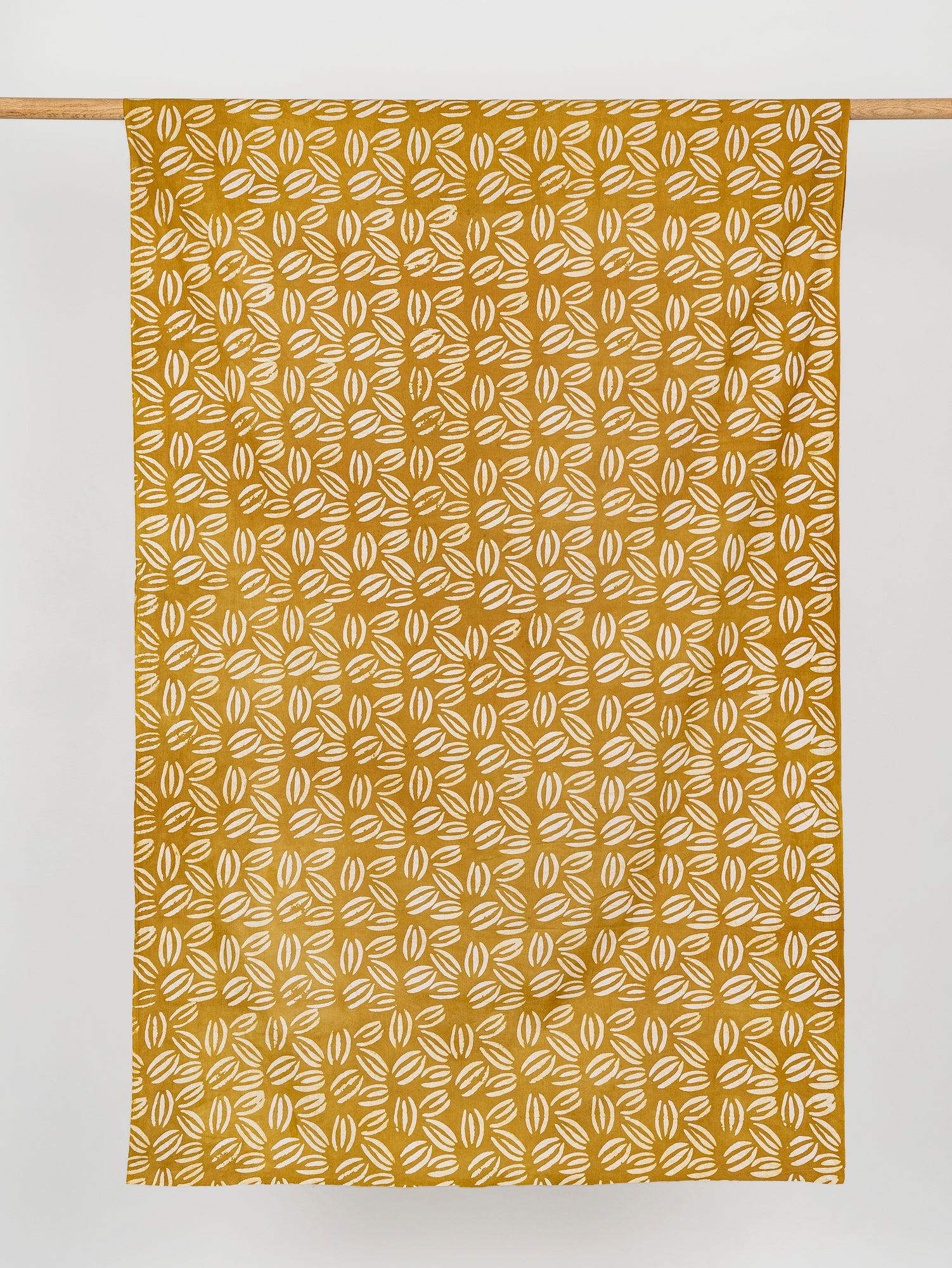 F-COT319-Coffee-Bean-Artisanal-Cotton-Batik-Ochre-White-Core-Fabrics-Draped