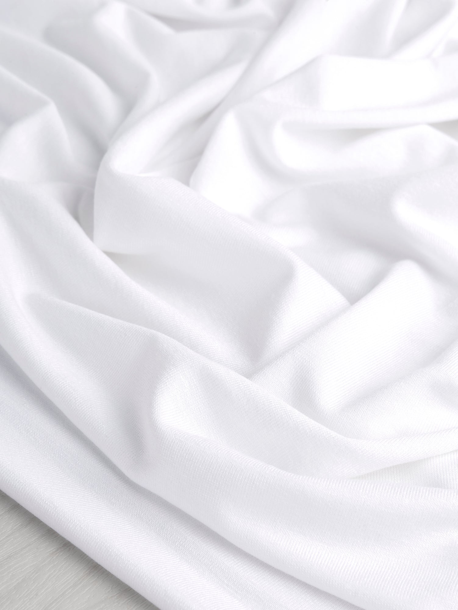 F-DEA069-Cotton-Stretch-Jersey-Deadstock-White-Core-Fabrics-scrunched.JPG