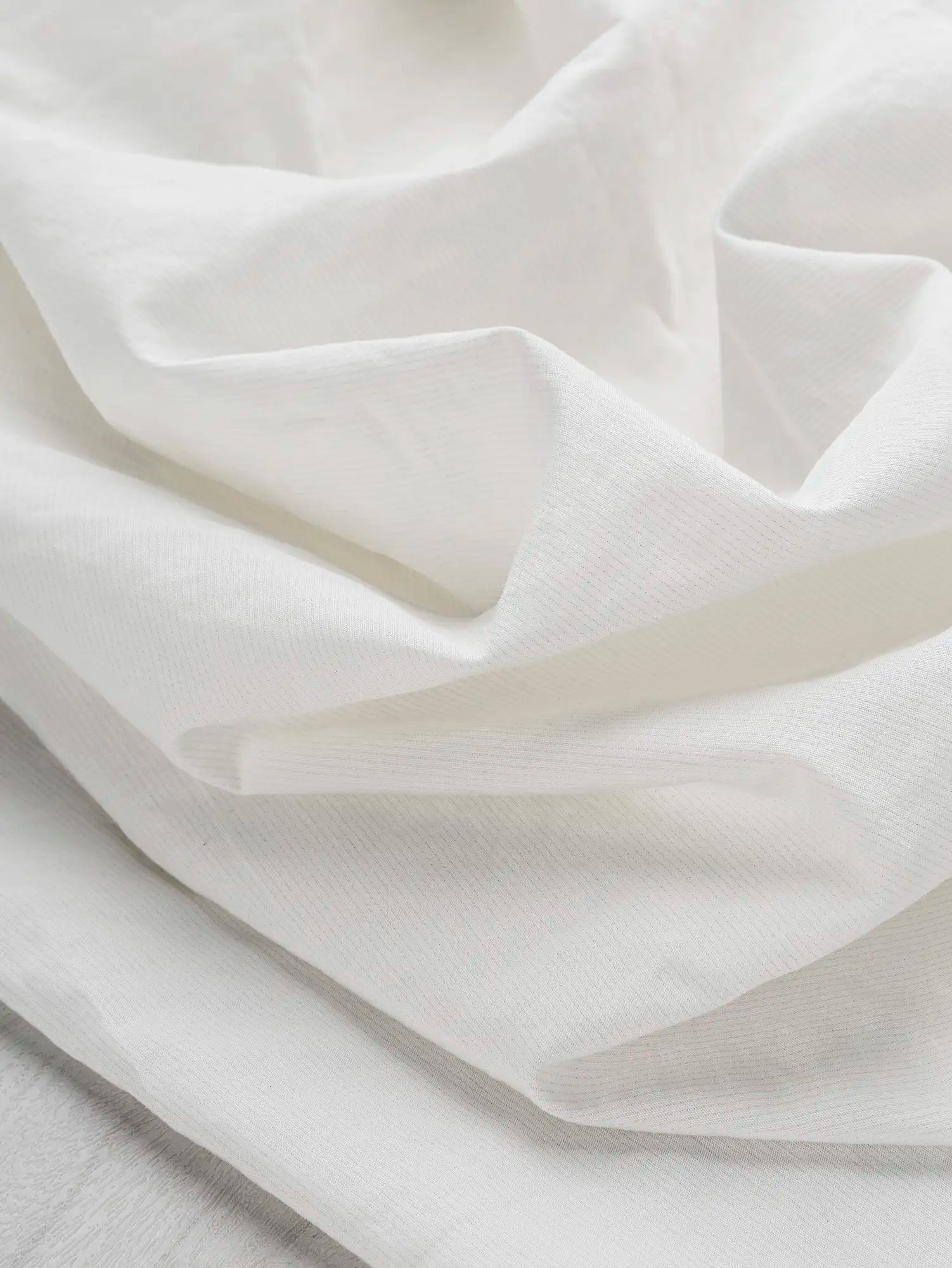 F-DEA221-Crinkled-Cotton-Blend-Broadcloth-Deadstock-White-Core-Fabrics-scrunched.webp