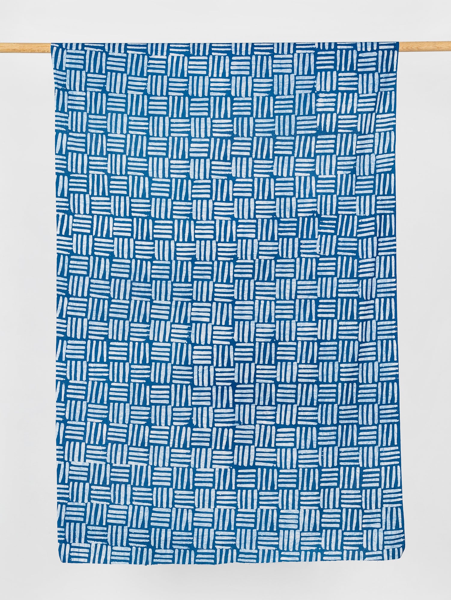 F-COT322-Crossgrid-Artisanal-Cotton-Batik-Teal-White-Core-Fabrics-draped
