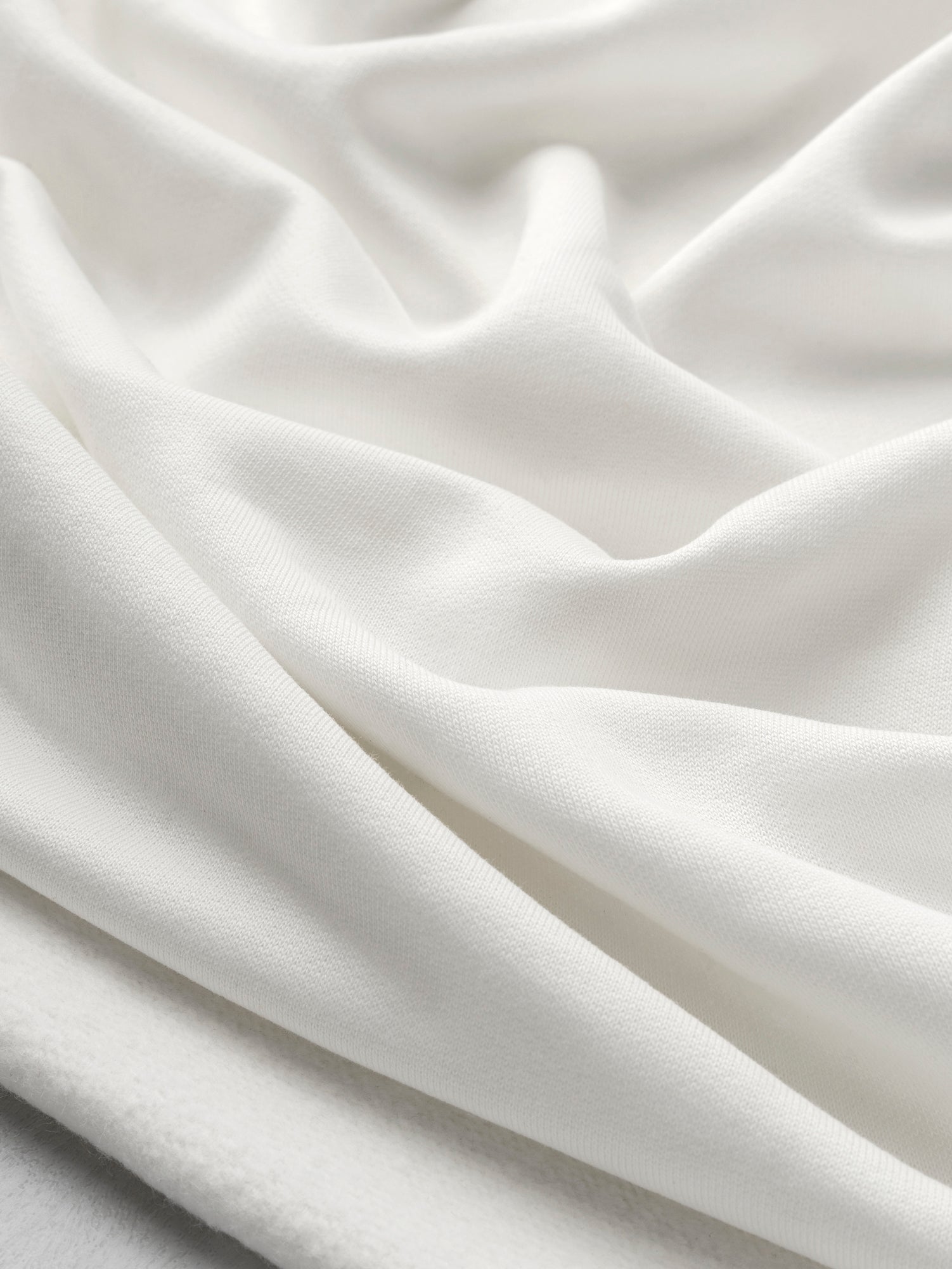 F-COT399-002-Custom-Organic-Cotton-Fleece-White-Core-Fabrics-scrunched.JPG