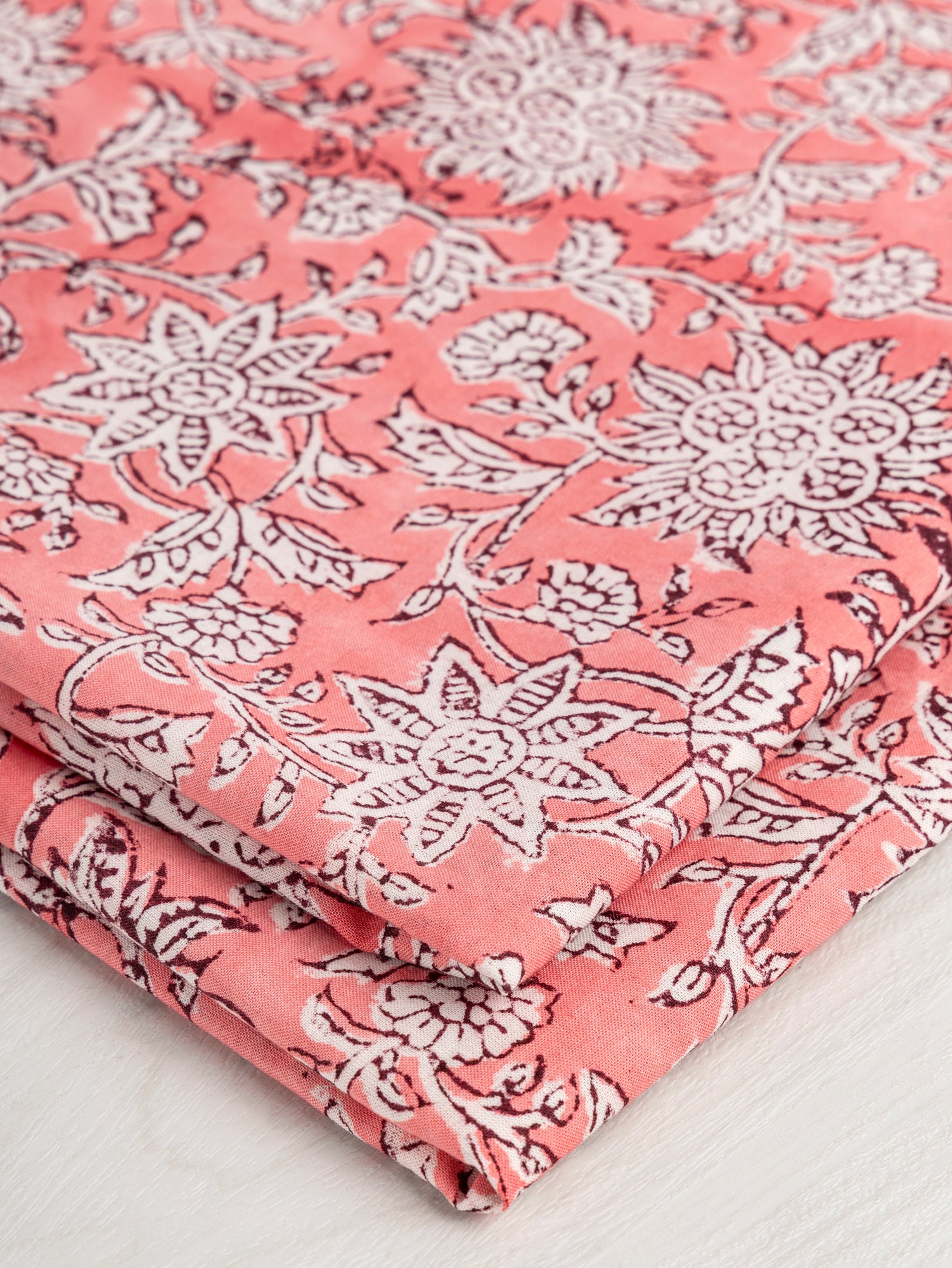 F-COT351-003-Dahlia-Block-Print-Cotton-Voile-White-Watermelon-Burgundy-Core-Fabrics-fold.JPG