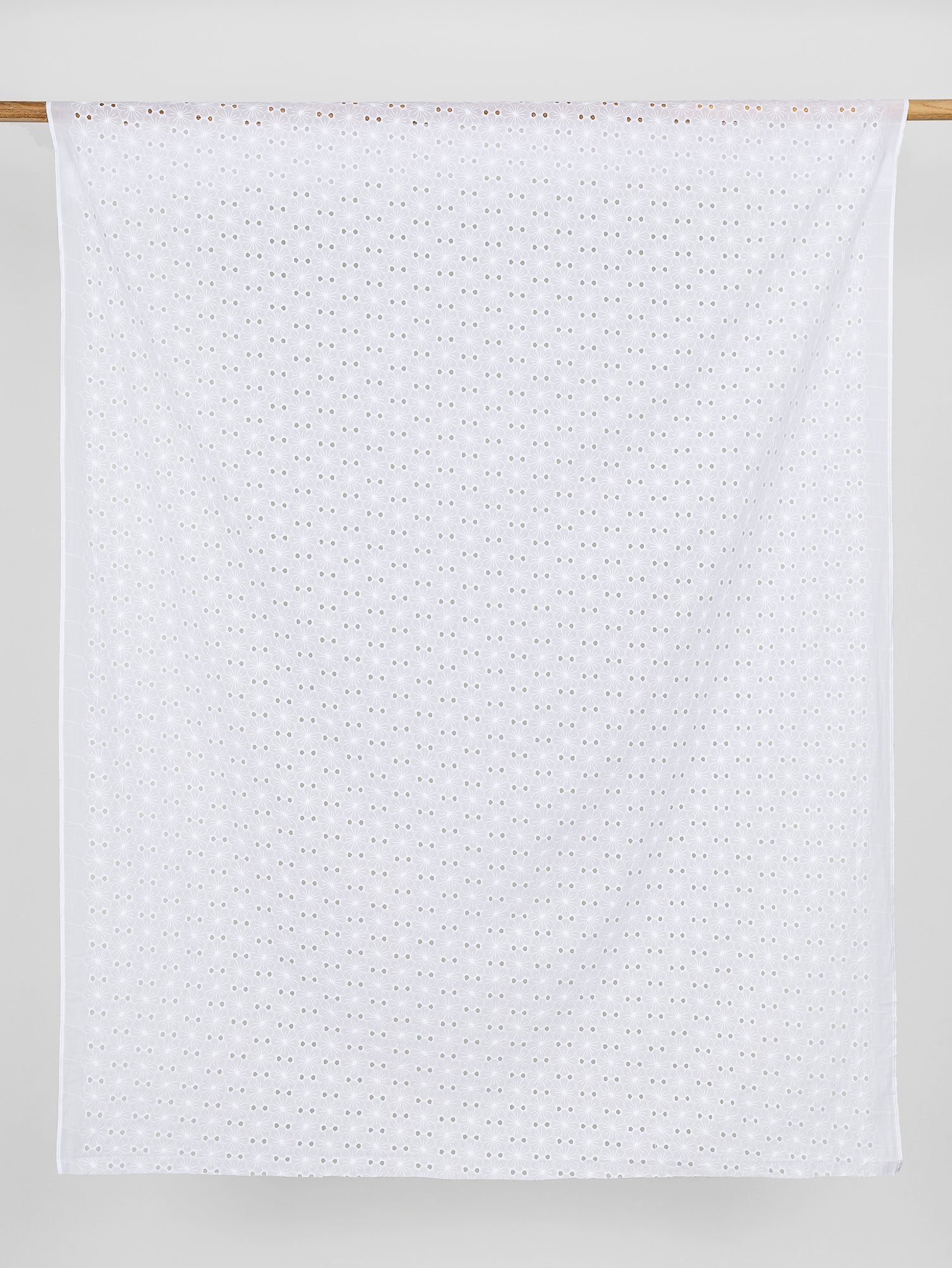 F-COT335-002-Daisy-Cotton-Eyelet-Deadstock-White-Core-Fabrics-draped
