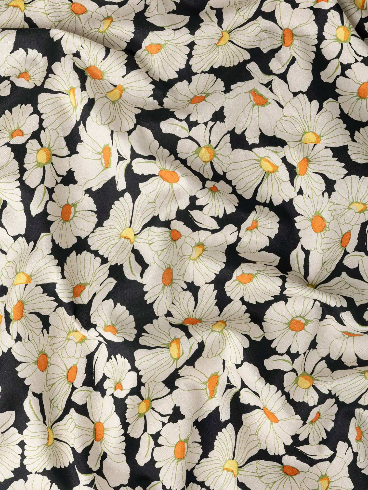 F-COT439-Daisy-Print-BCI-Cotton-Lawn-Black-Cream-and-Orange-Core-Fabrics-scrunched.webp