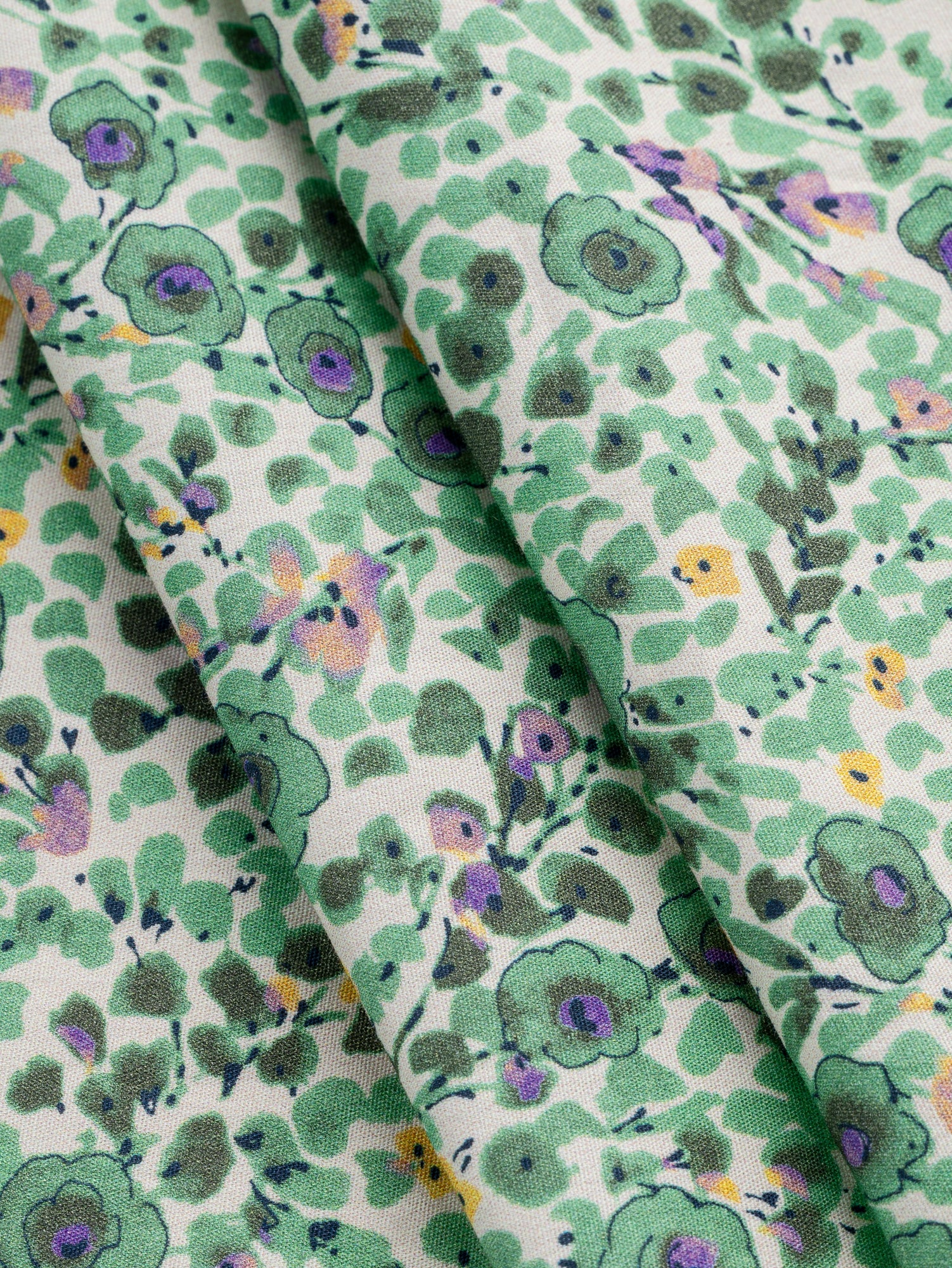 F-COT386-Ditzy-Bloom-Sketch-Print-Cotton-Poplin-Cream-Green-Purple-Core-Fabrics-fold.JPG