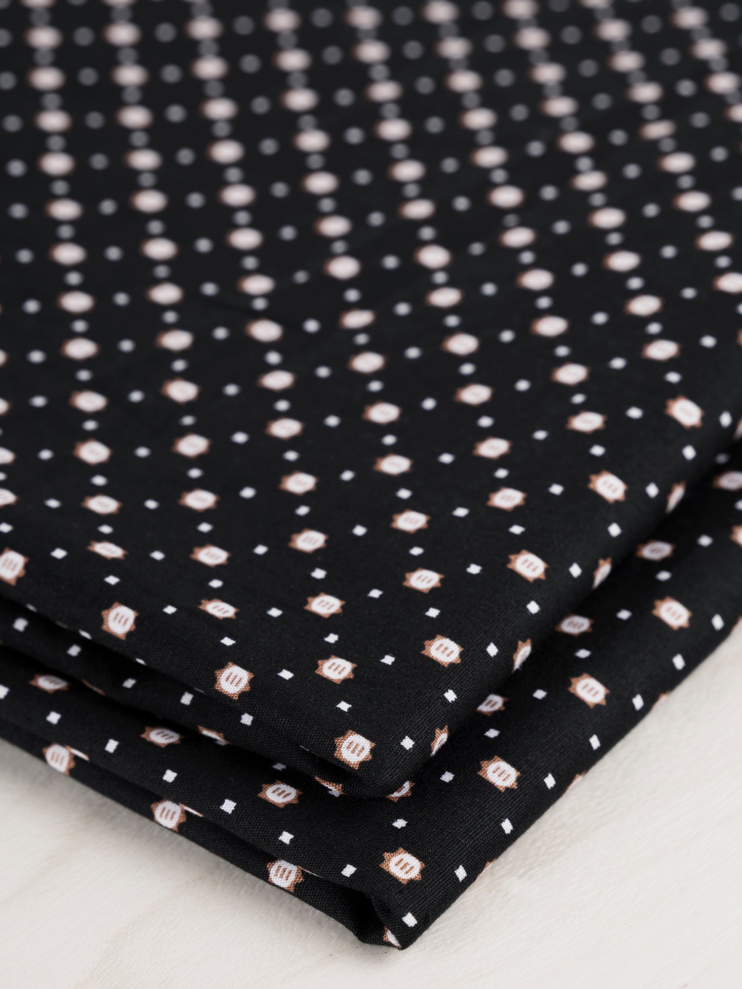 F-DEA034-Ditzy-Circle-Square-Cotton-Shirting-Deadstock-Black-White-Brown-Core-Fabrics-fold.JPG