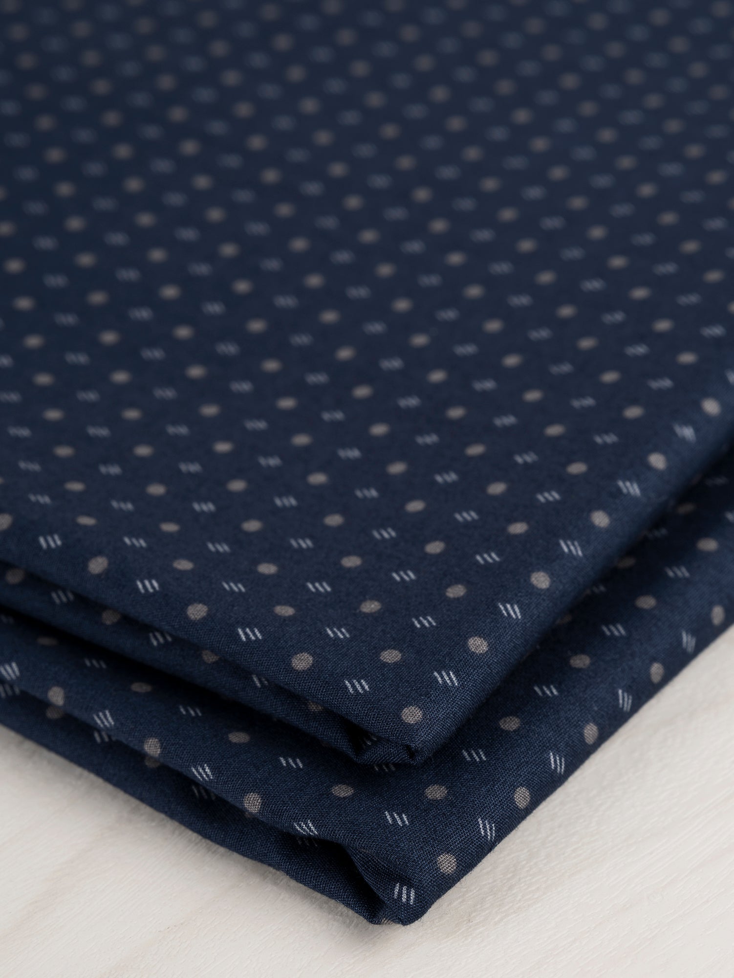 F-DEA035-001-Ditzy-Dot-Stripe-Cotton-Shirting-Deadstock-Navy-Grey-Core-Fabrics-fold.JPG