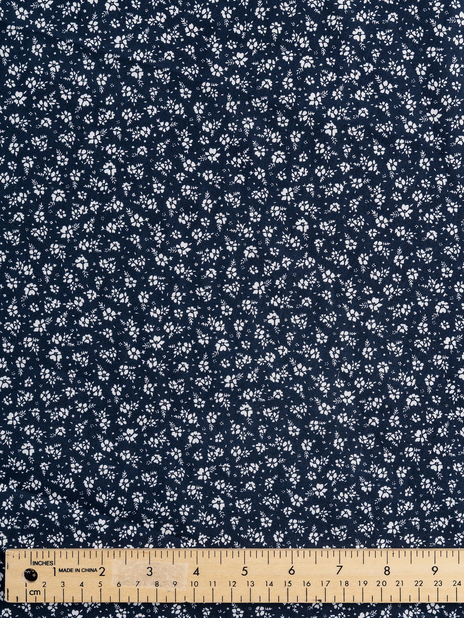 F-DEA030-Ditzy-Floral-Cotton-Shirting-Deadstock-Navy-White-Core-Fabrics-ruler.JPG