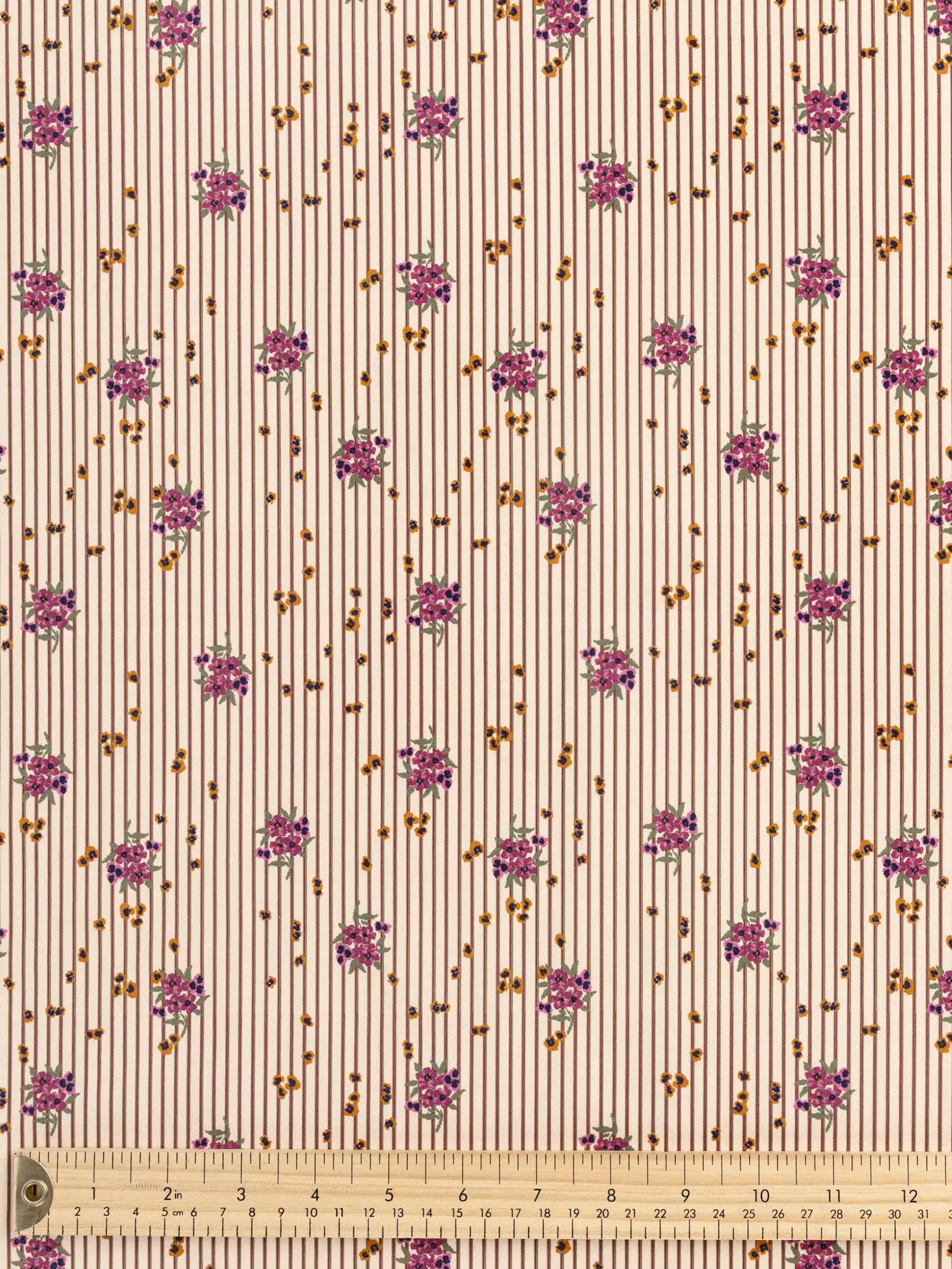 F-COT441-Ditzy-Floral-Stripe-Print-BCI-Cotton-Poplin-Beige-Brown-and-Purple-Core-Fabrics-ruler.webp