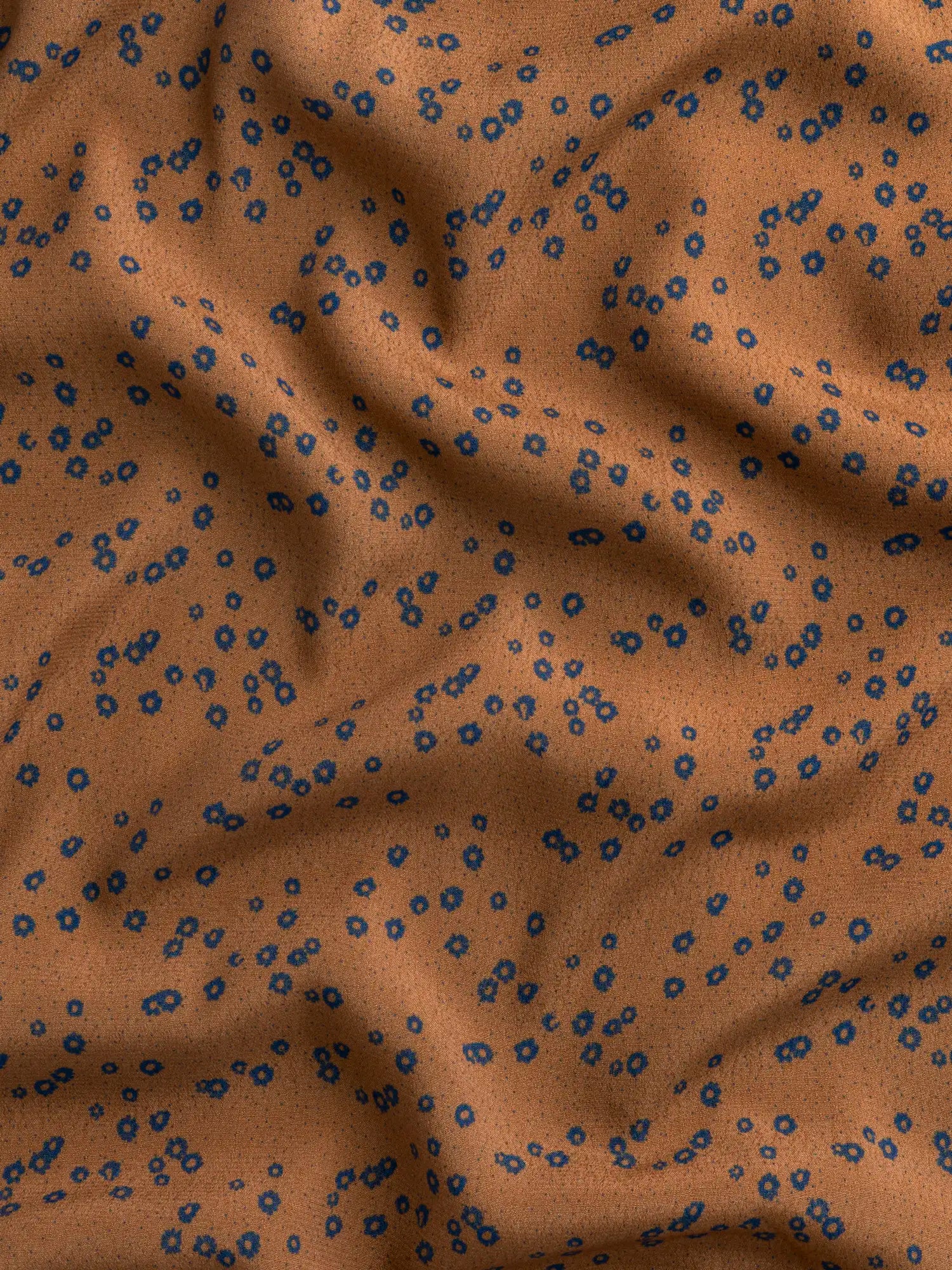 F-VIS296-Ditzy-Flower-Dot-Print-Ecovero-Crepe-de-Chine-Caramel-Indigo-Core-Fabrics-scrunched.webp