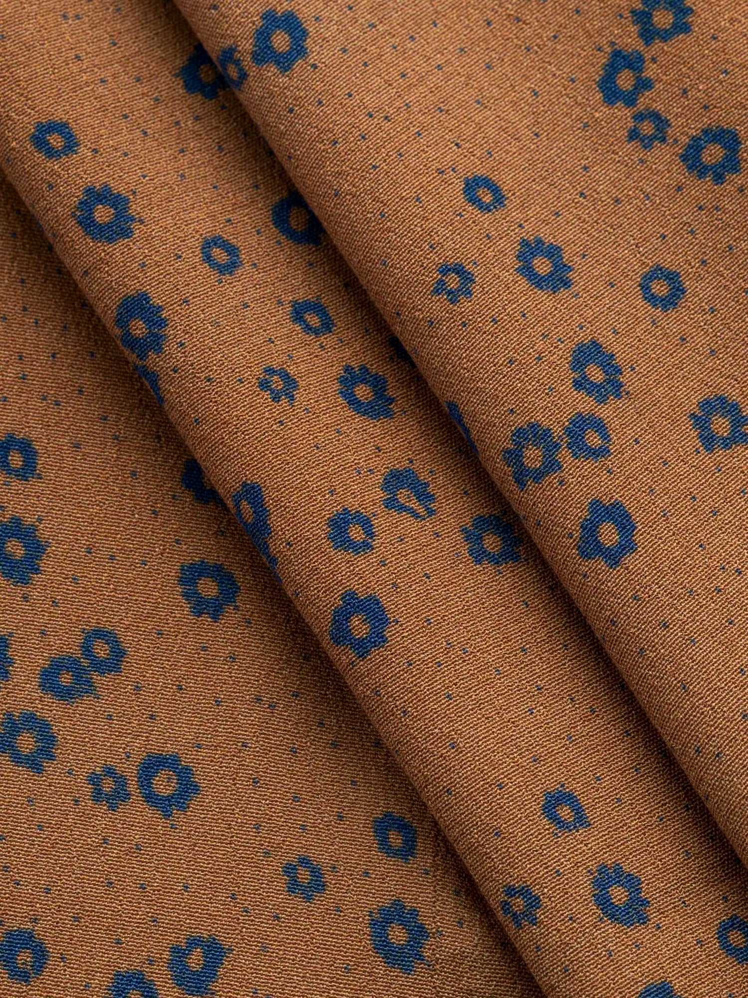 F-VIS296-Ditzy-Flower-Dot-Print-Ecovero-Crepe-de-Chine-Caramel-Indigo-Core-Fabrics-F-VIS296-Ditzy-Flower-Dot-Print-Ecovero-Crepe-de-Chine-Caramel-Indigo-Core-Fabrics-fold.webp