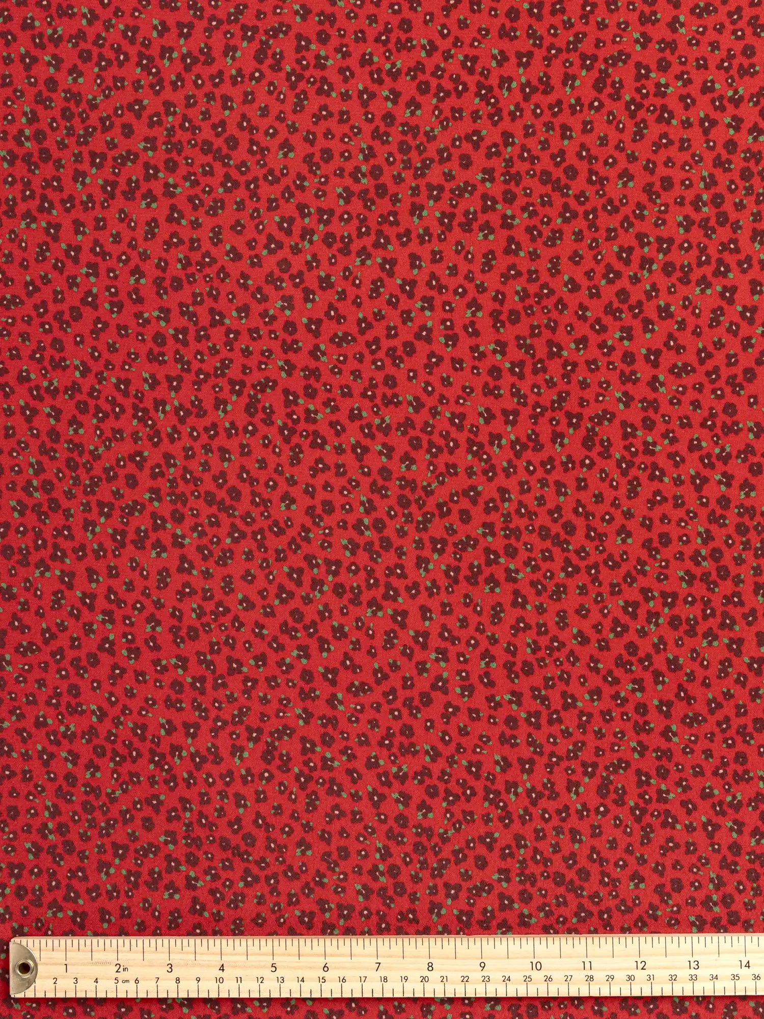 F-VIS297-Ditzy-Flower-Print-Ecovero-Crepe-de-Chine-Ruby-Burgundy-and-Leaf-Core-Fabrics-ruler.webp