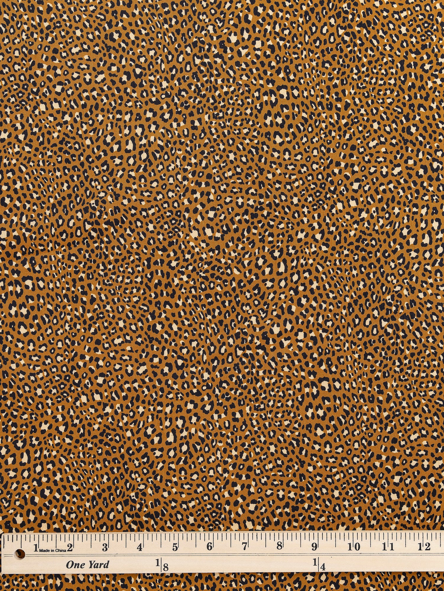 F-COT328-Ditzy-Leopard-Print-Cotton-Lawn-Ochre-Black-Beige-Core-Fabrics-ruler