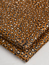 F-COT328-Ditzy-Leopard-Print-Cotton-Lawn-Ochre-Black-Beige-Core-Fabrics-fold