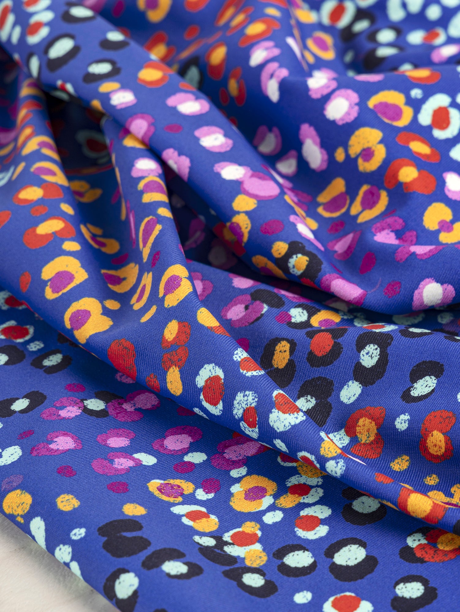 F-DEA038-Dot-Swim-Performance-Knit-Deadstock-Blue-and-Multicolour-Core-Fabrics-scrunched.JPG