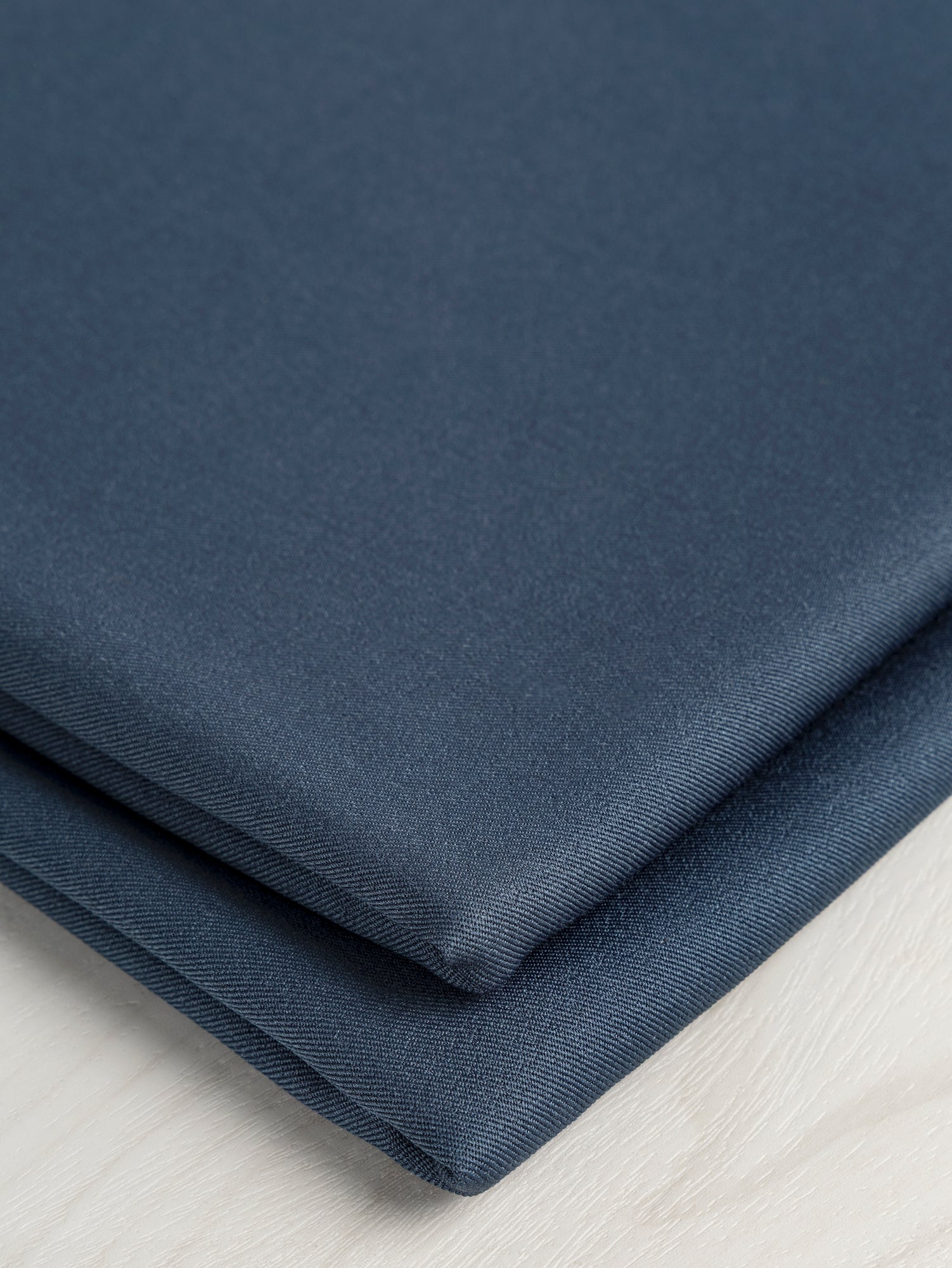 F-DEA053-Drapey-Slight-Stretch-Twill-Deadstock-Navy-Core-Fabrics-fold.JPG