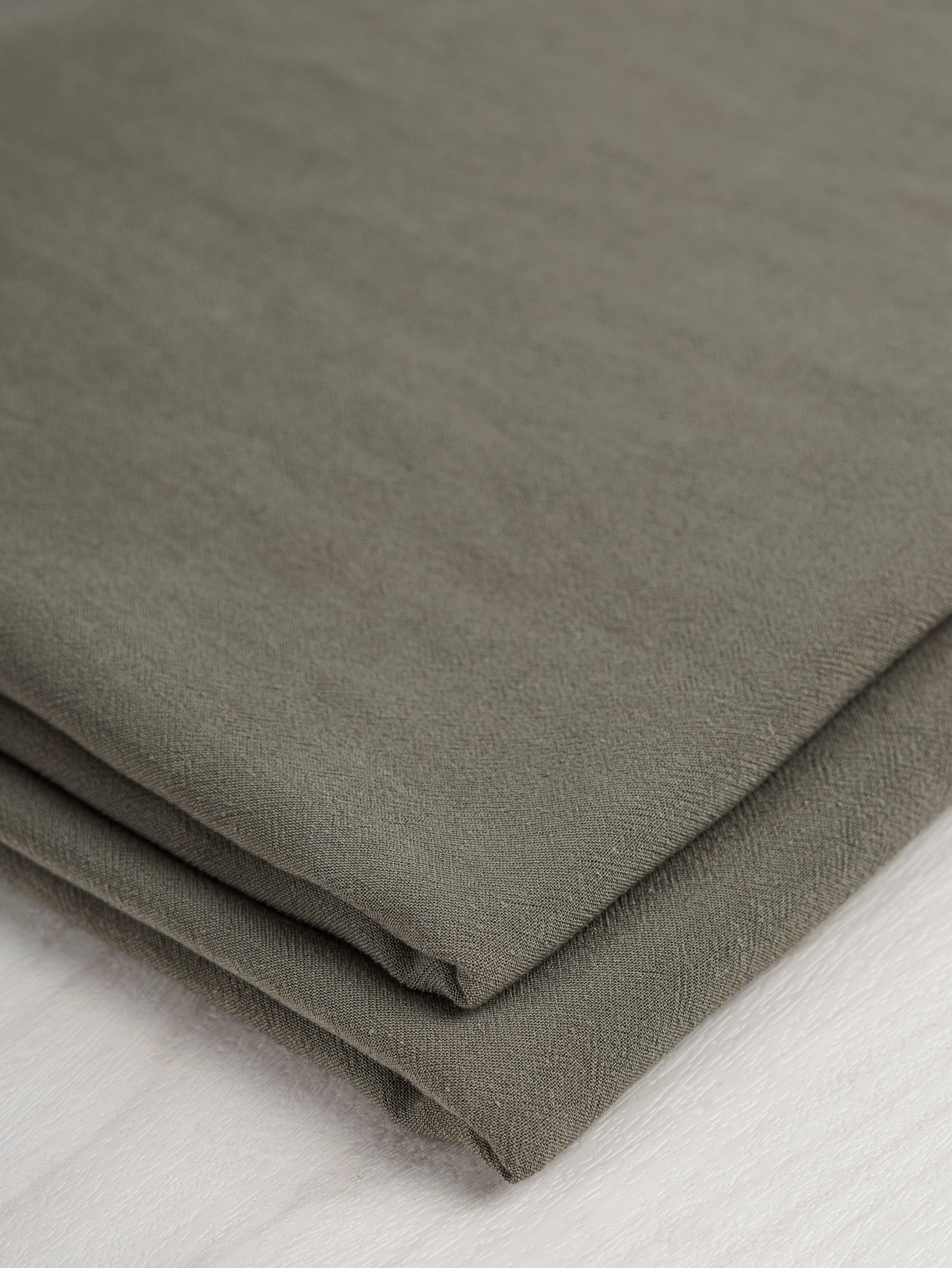 F-DEA045-Drapey-Viscose-Linen-Deadstock-Olive-Core-Fabrics-fold.JPG