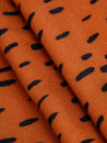 F-VIS257-Drop-Print-Viscose-Crepe-Terracotta-Black-Core-Fabrics-fold.JPG