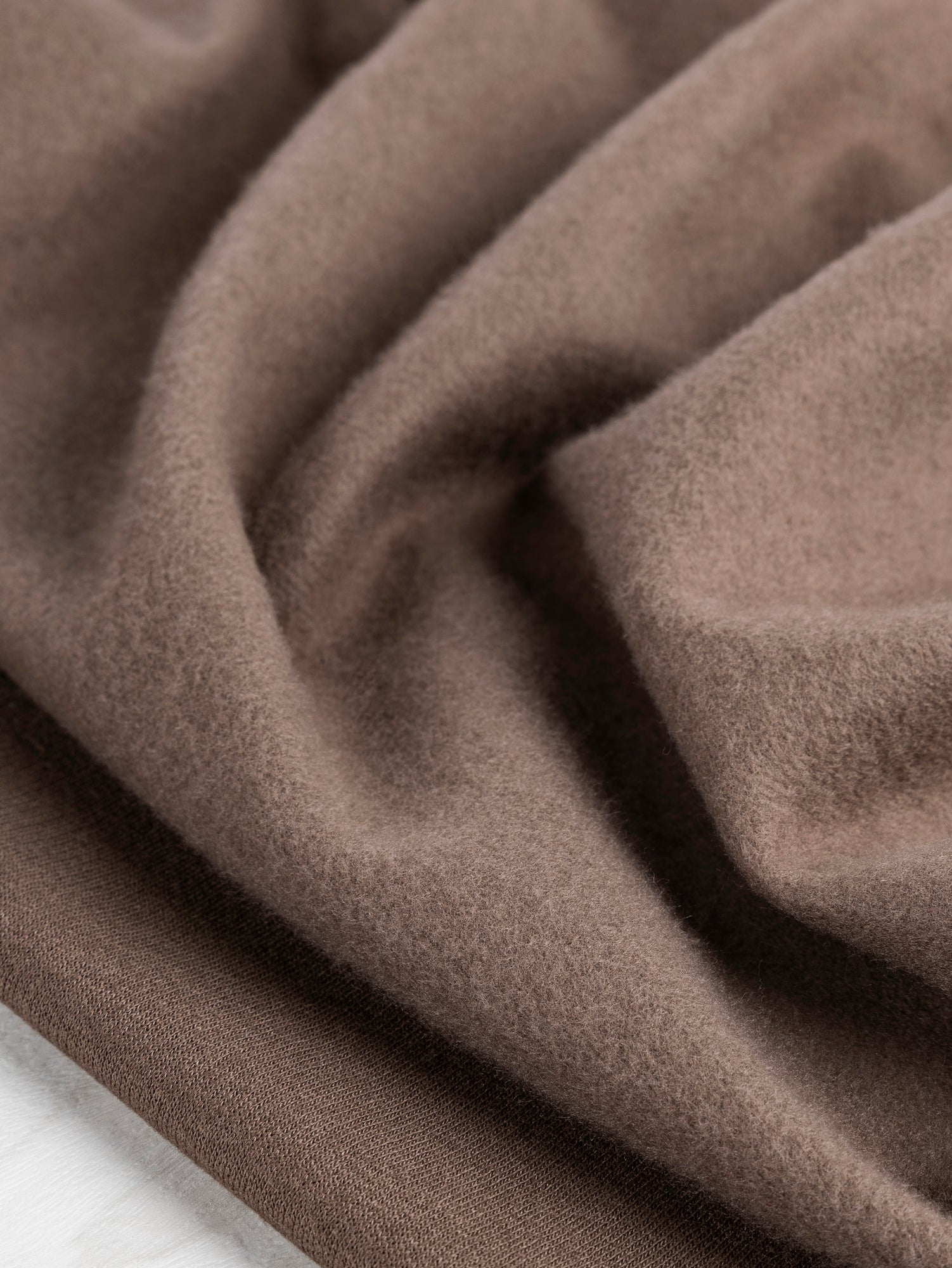 F-COT354-001-Eco-Slight-Stretch-Fleece-Deadstock-Brown-Core-Fabrics-scrunched.JPG