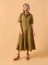 Woman wearing a green dress Edith Dress Sewing Pattern