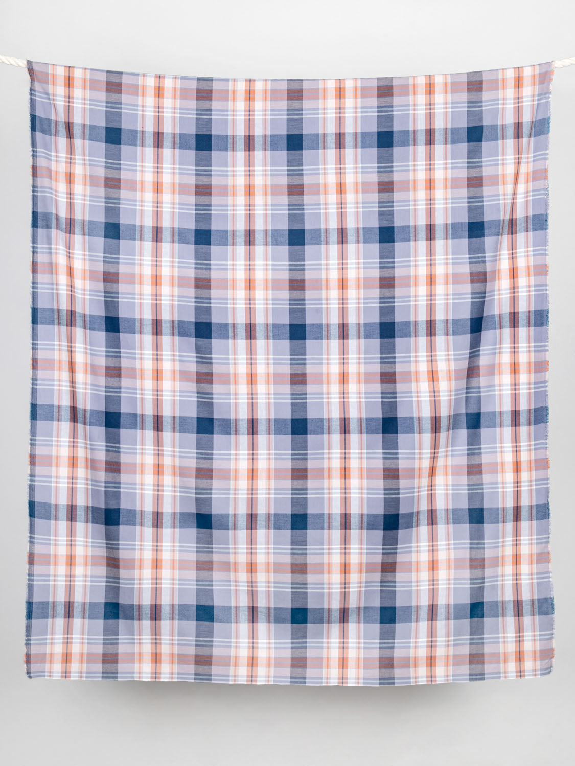 https://corefabricstore.com/cdn/shop/files/F-COT166-Check-Cotton-Deadstock-Lavender-and-Navy-and-Rust-core-fabrics-draped_2048x.jpg?v=1684258294