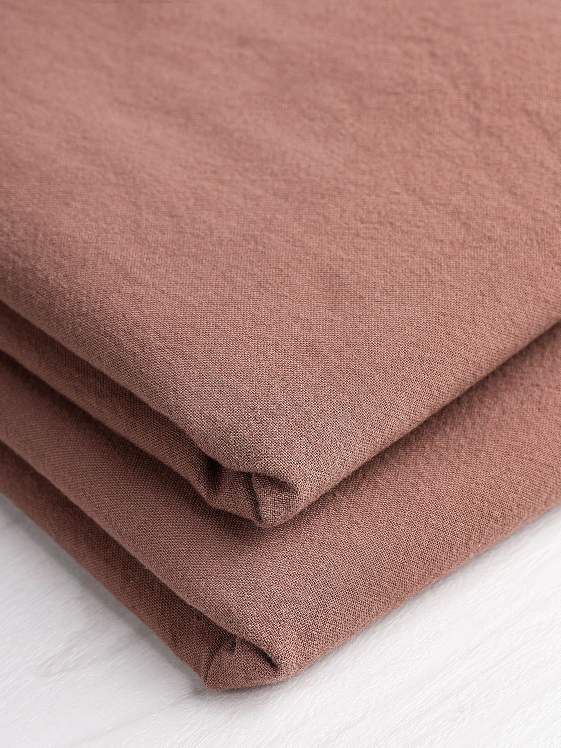 https://corefabricstore.com/cdn/shop/files/F-COT200-006-Tumbled-Non-Stretch-Cotton-Antique-Rose-Core-Fabrics-fold.jpg?v=1685539413&width=1125