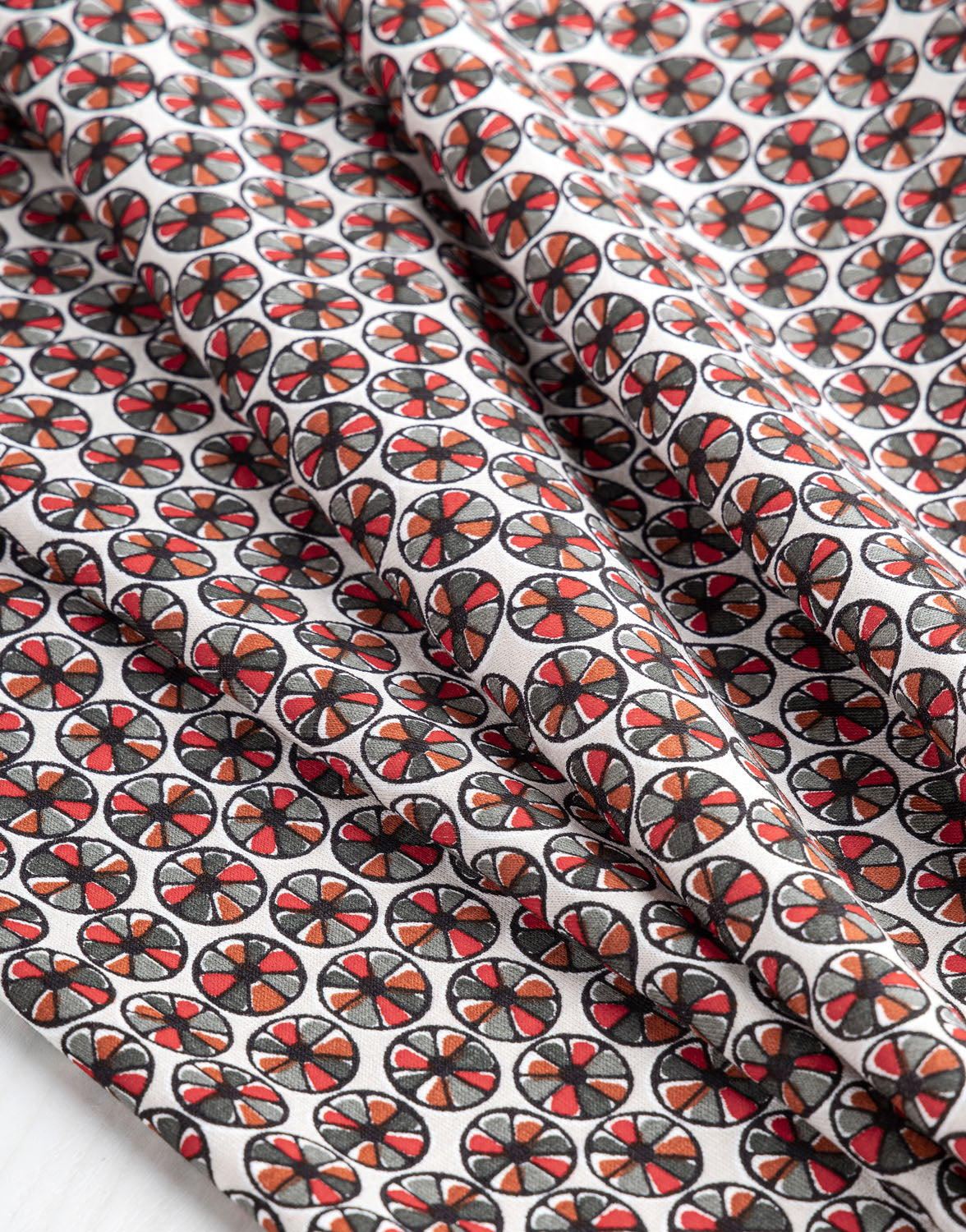 Wagon Wheel Knit Print Designer Deadstock - Cream + Red + Black | Core Fabrics