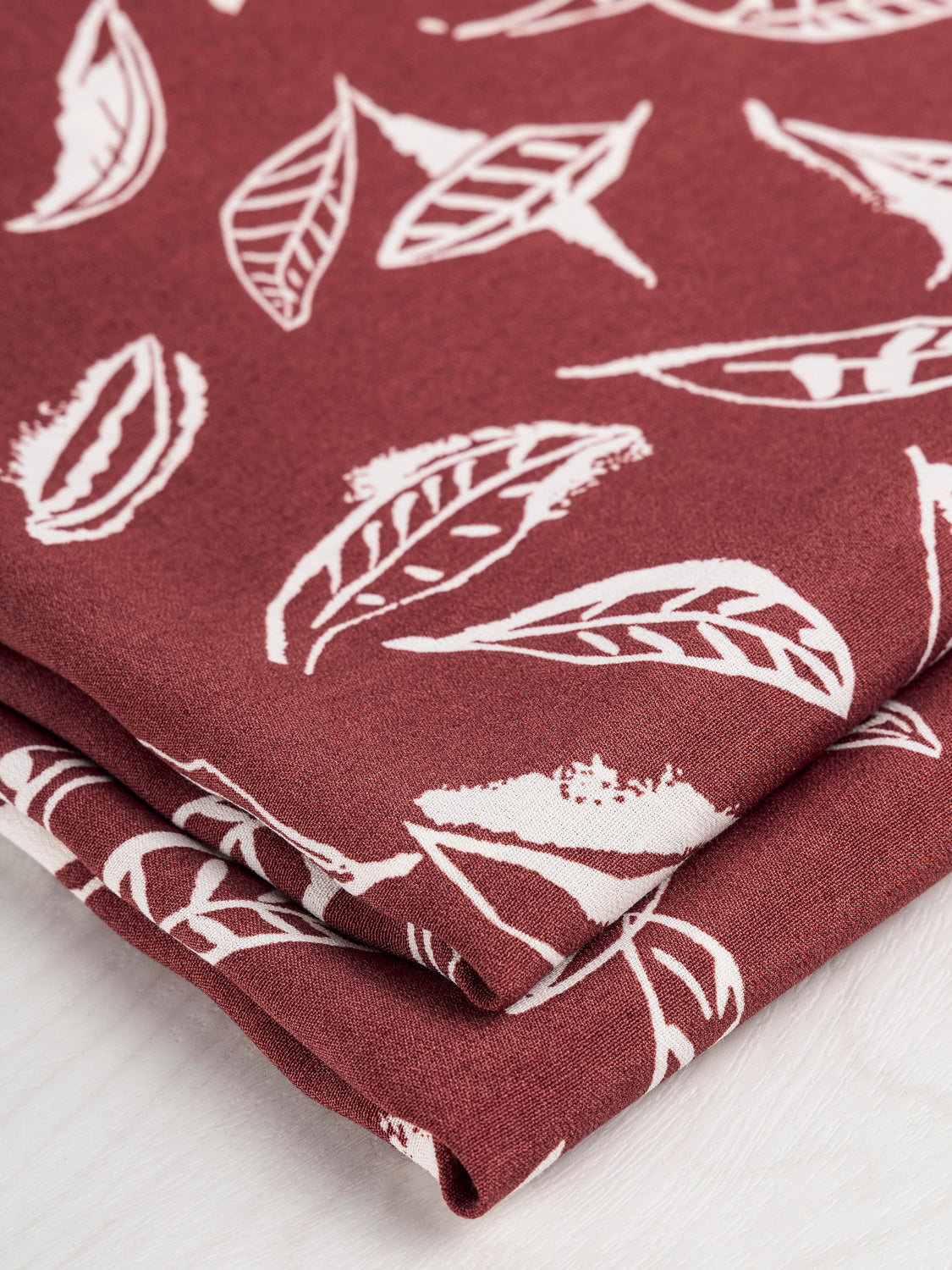 Illustrated Leaf Print Viscose Deadstock - Cream + Maroon | Core Fabrics