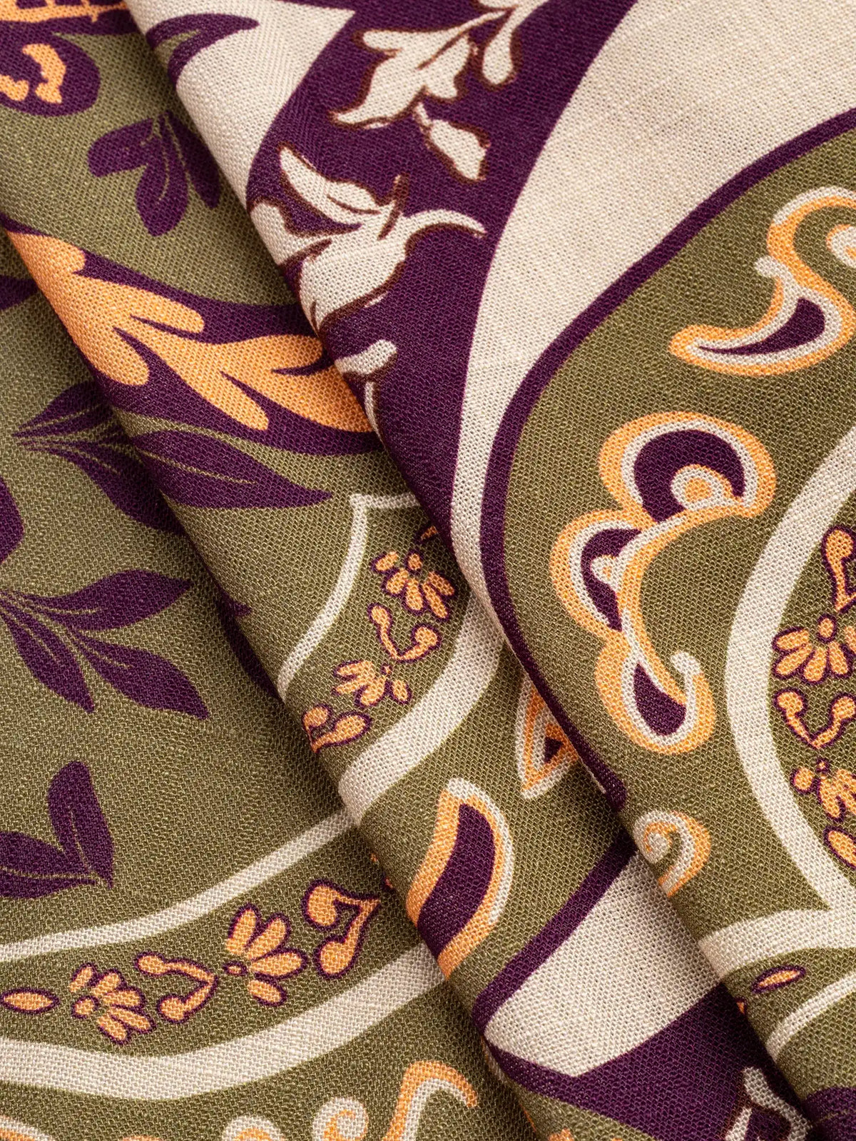 F-VIS319-Ornemental-Palm-Tree-Border-Print-Textured-Viscose-Olive-Aubergine-Oat-and-Coral-Core-Fabrics-fold.webp