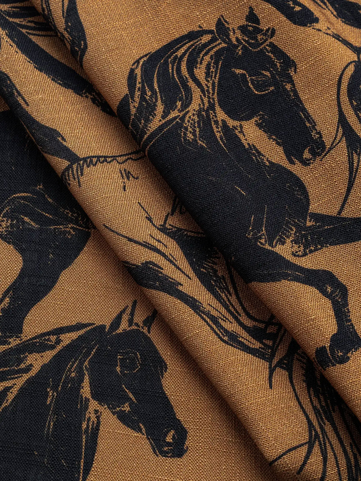 F-VIS320-Wild-Horse-Print-Textured-Viscose-Caramel-and-Black-Core-Fabrics-fold.webp