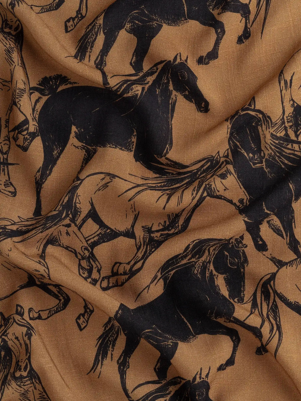 F-VIS320-Wild-Horse-Print-Textured-Viscose-Caramel-and-Black-Core-Fabrics-scrunched.webp