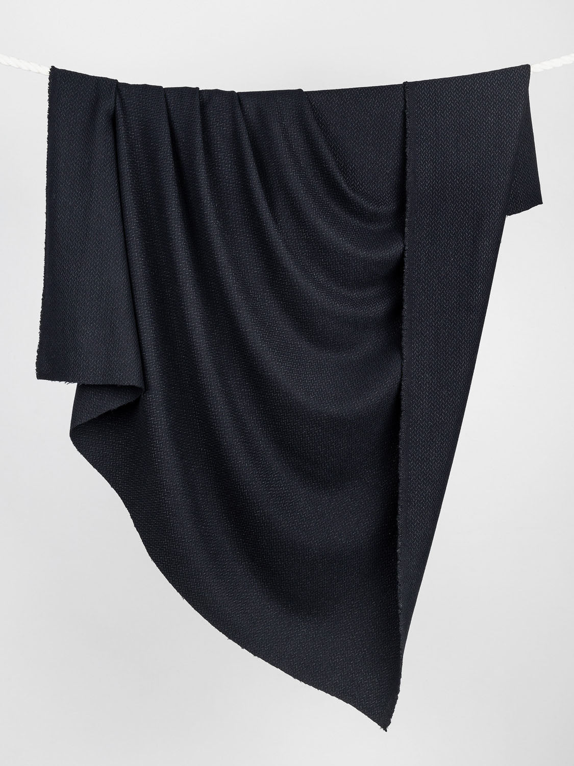 F-WOL056-Italian-Tweed-Coating-Deadstock-Black-Core-Fabrics-draped_61d70f0e-87bb-45b9-b915-8af8cf737c8c.jpg