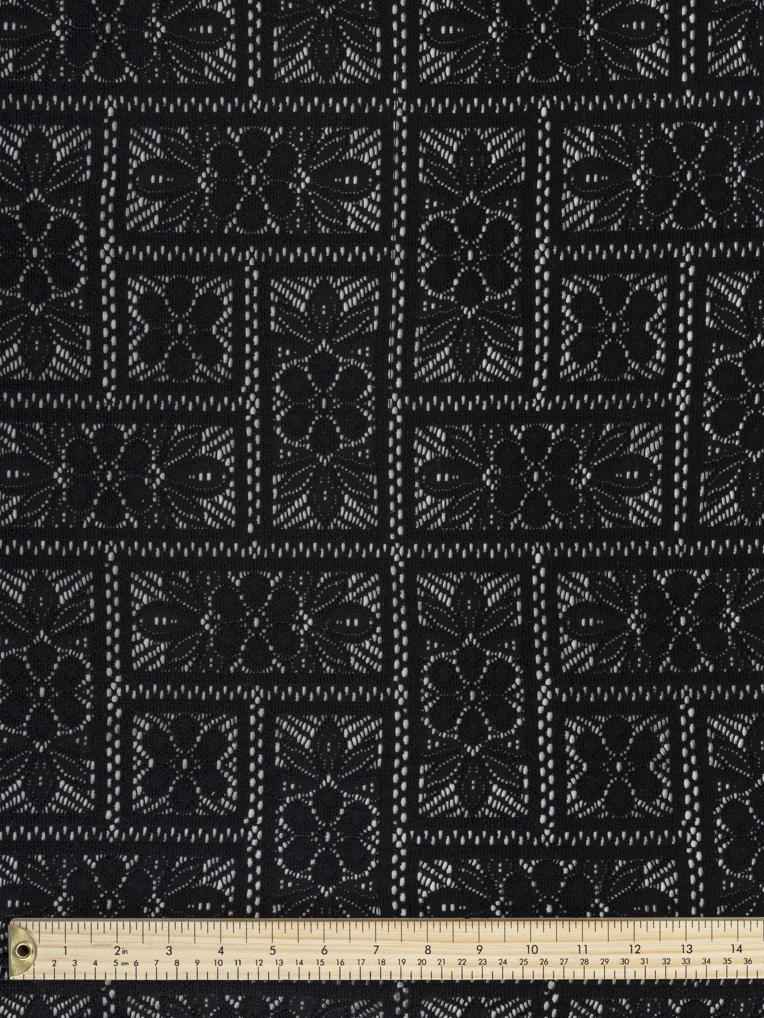 F-DEA043-Floral-Crochet-Stretch-Knit-Deadstock-Black-Core-Fabrics-ruler.JPG