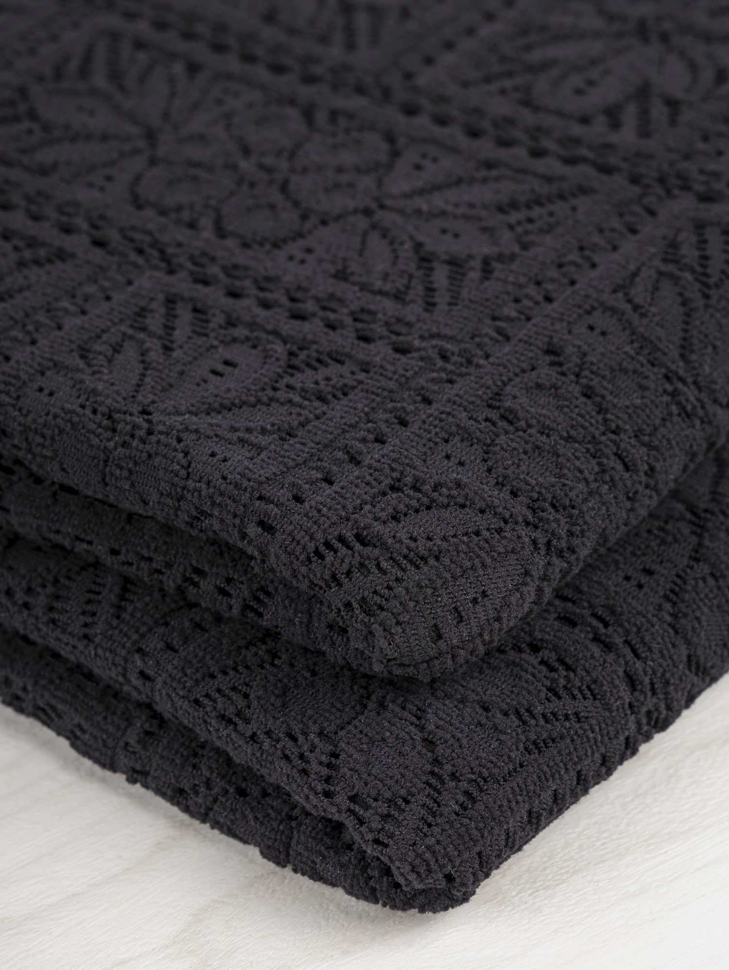 F-DEA043-Floral-Crochet-Stretch-Knit-Deadstock-Black-Core-Fabrics-fold.JPG