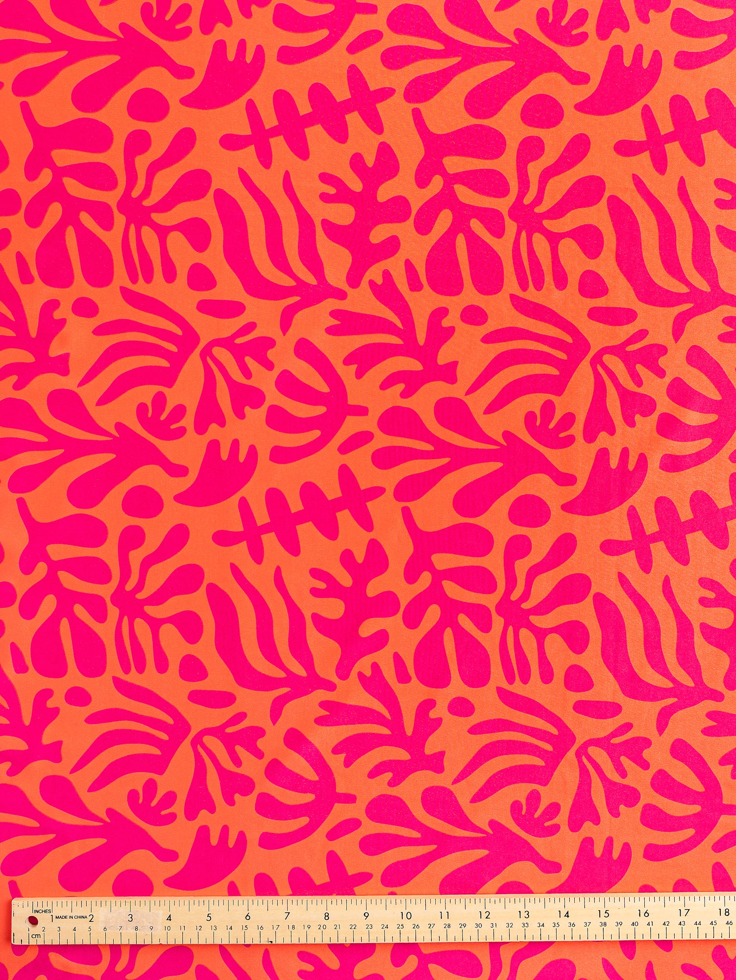 F-PES036-002-Floral-Cut-Out-Print-Recycled-Swim-Performance-Knit-Orange-Raspberry-Core-Fabrics-ruler.JPG