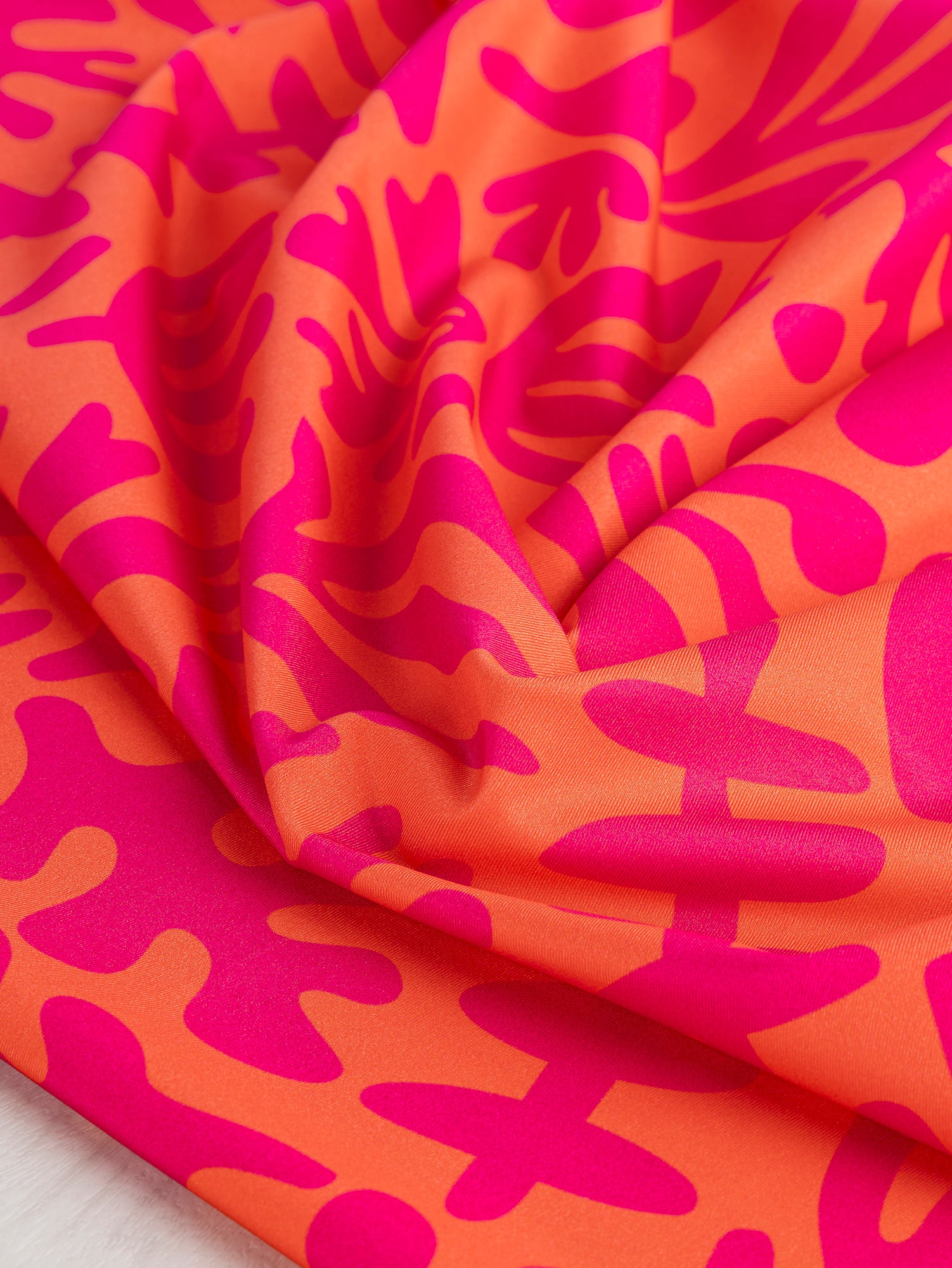 F-PES036-002-Floral-Cut-Out-Print-Recycled-Swim-Performance-Knit-Orange-Raspberry-Core-Fabrics-scrunched.JPG