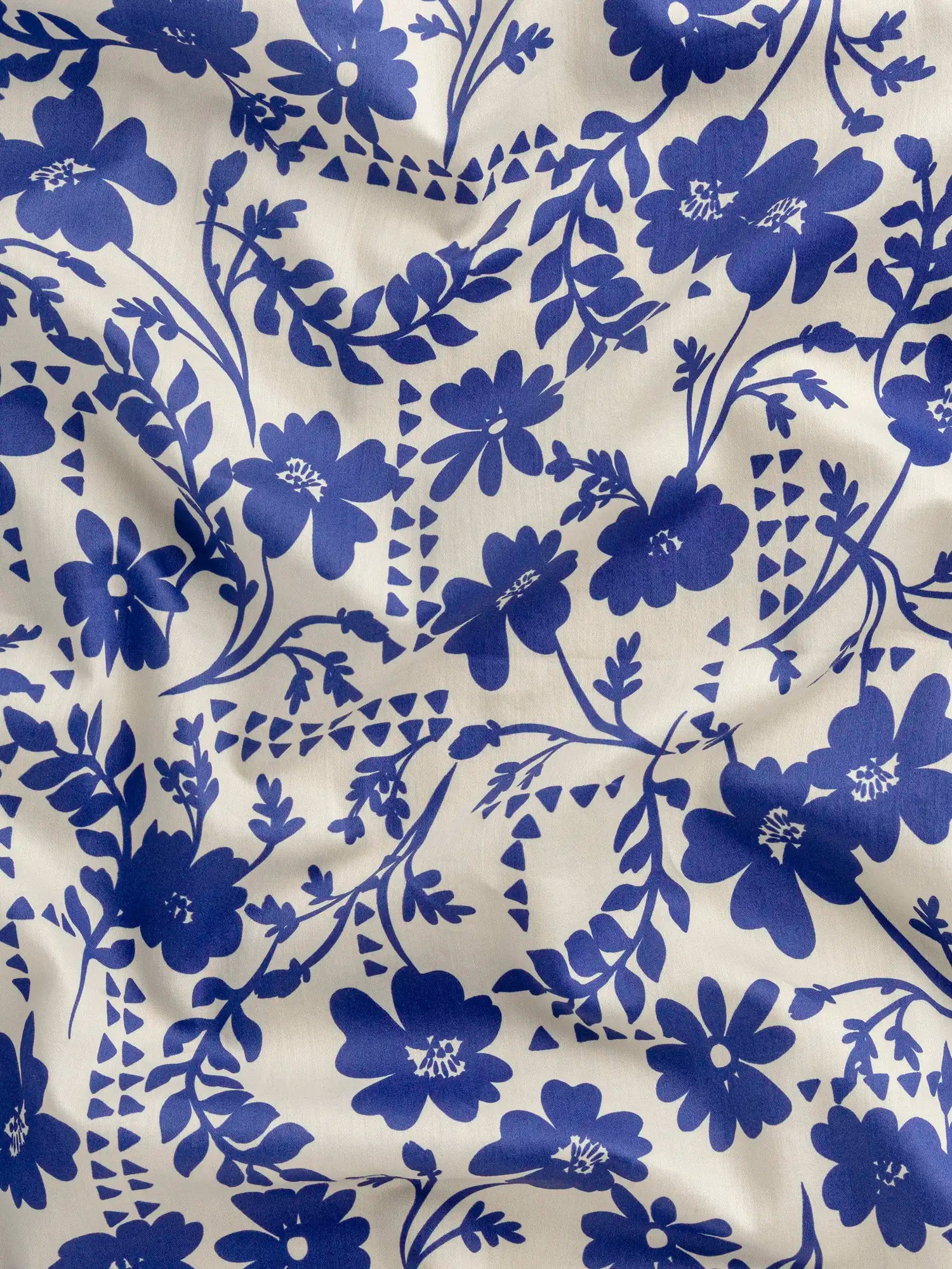 F-COT437-Floral-Reverie-Print-BCI-Cotton-Lawn-Cream-and-Cobalt-Blue-Core-Fabrics-scrunched.webp