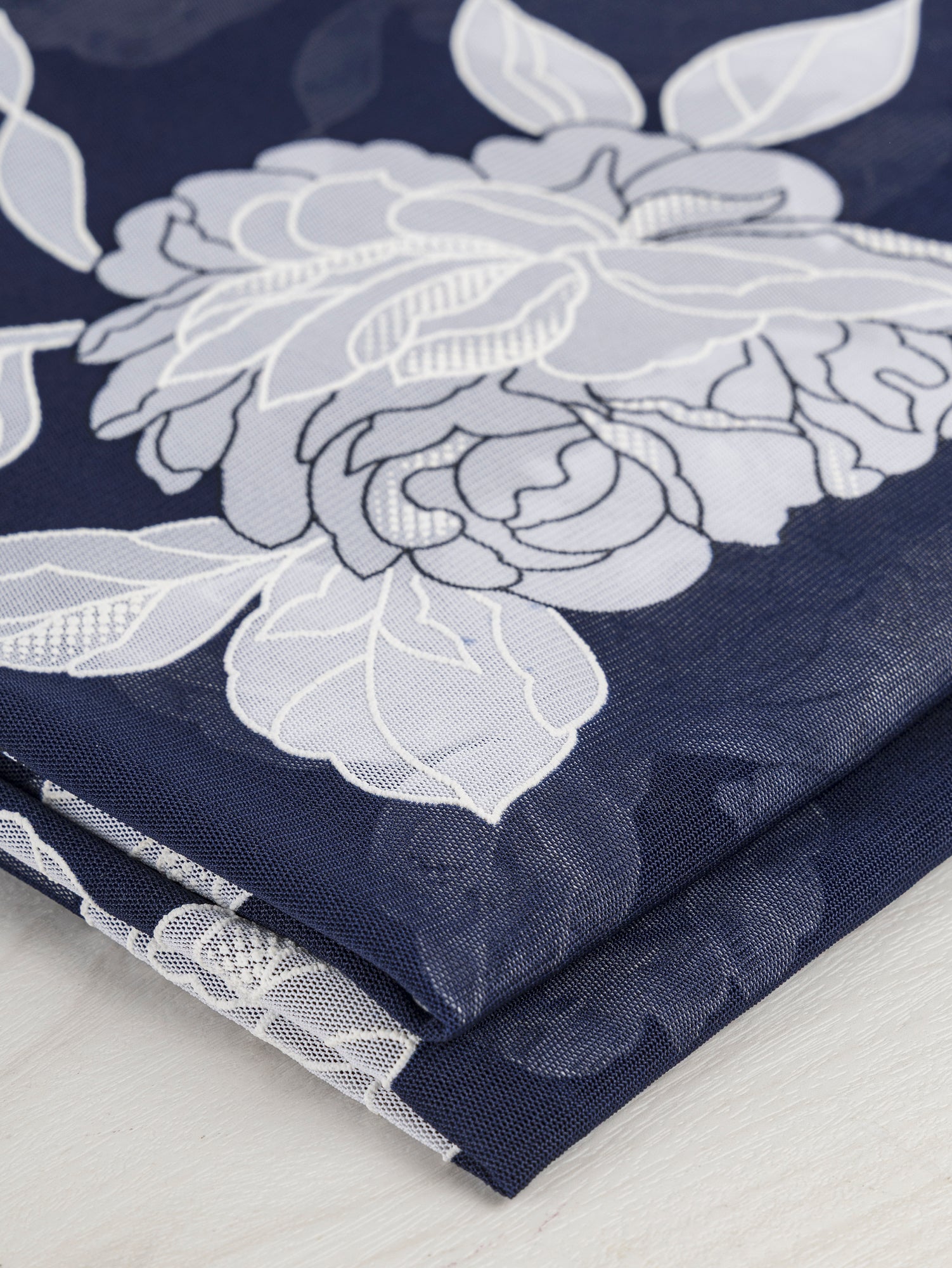 F-DEA041-Floral-Stretch-Mesh-Deadstock-Navy-and-White-Core-Fabrics-fold.JPG