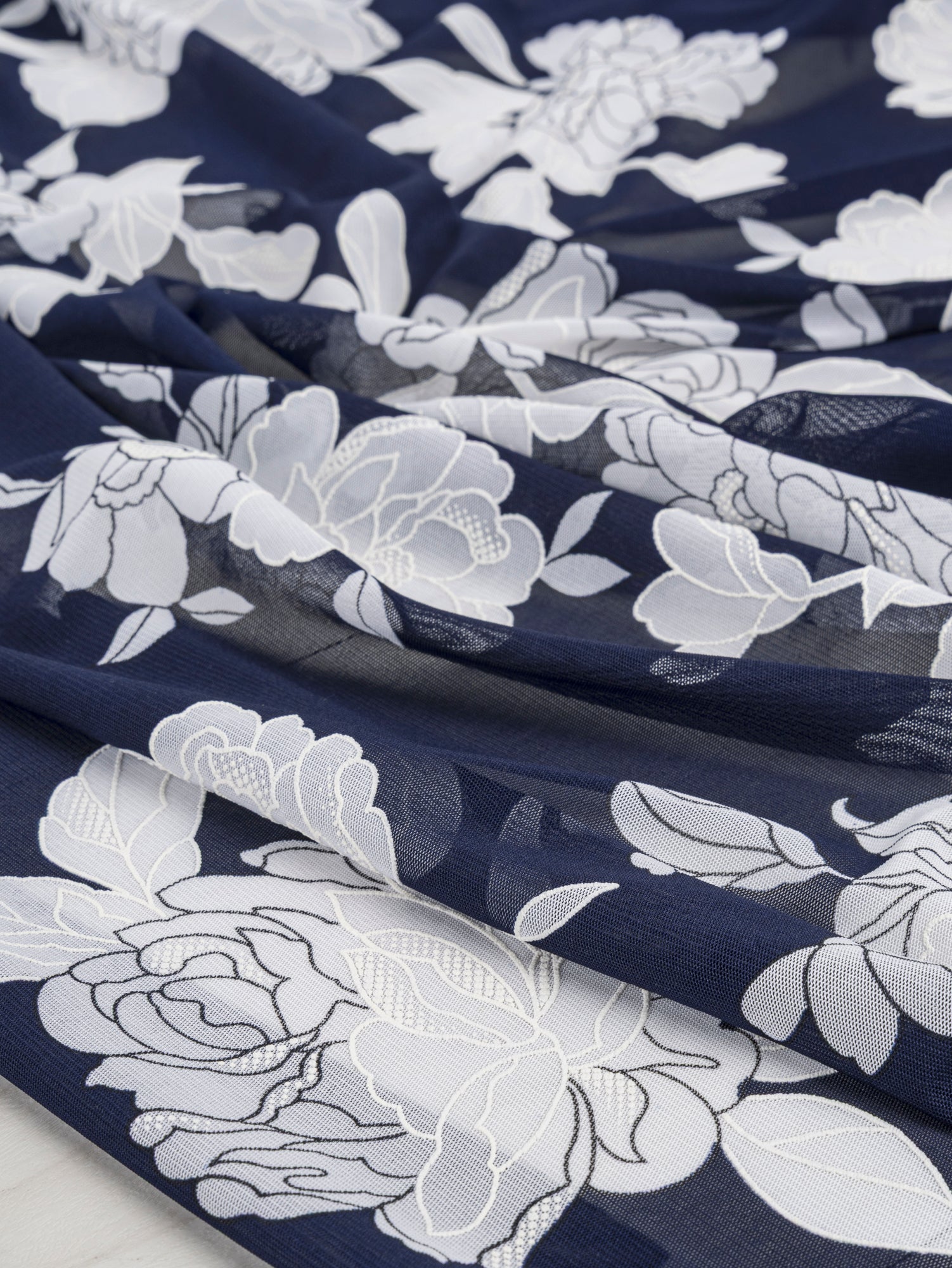 F-DEA041-Floral-Stretch-Mesh-Deadstock-Navy-and-White-Core-Fabrics-scrunched.JPG