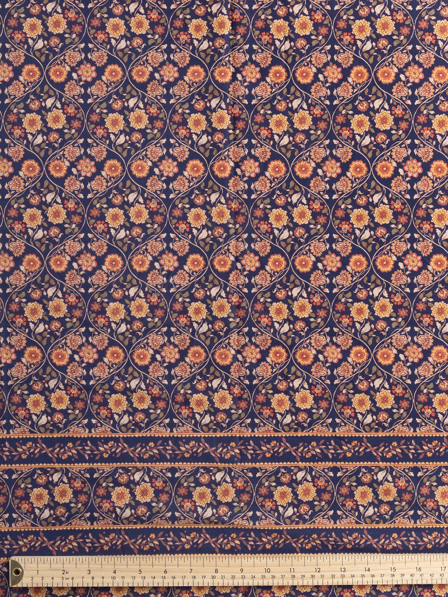 F-COT389-Floral-Trellis-Border-Print-Cotton-Lawn-Indigo-Terracotta-and-Olive-Core-Fabrics-ruler.JPG