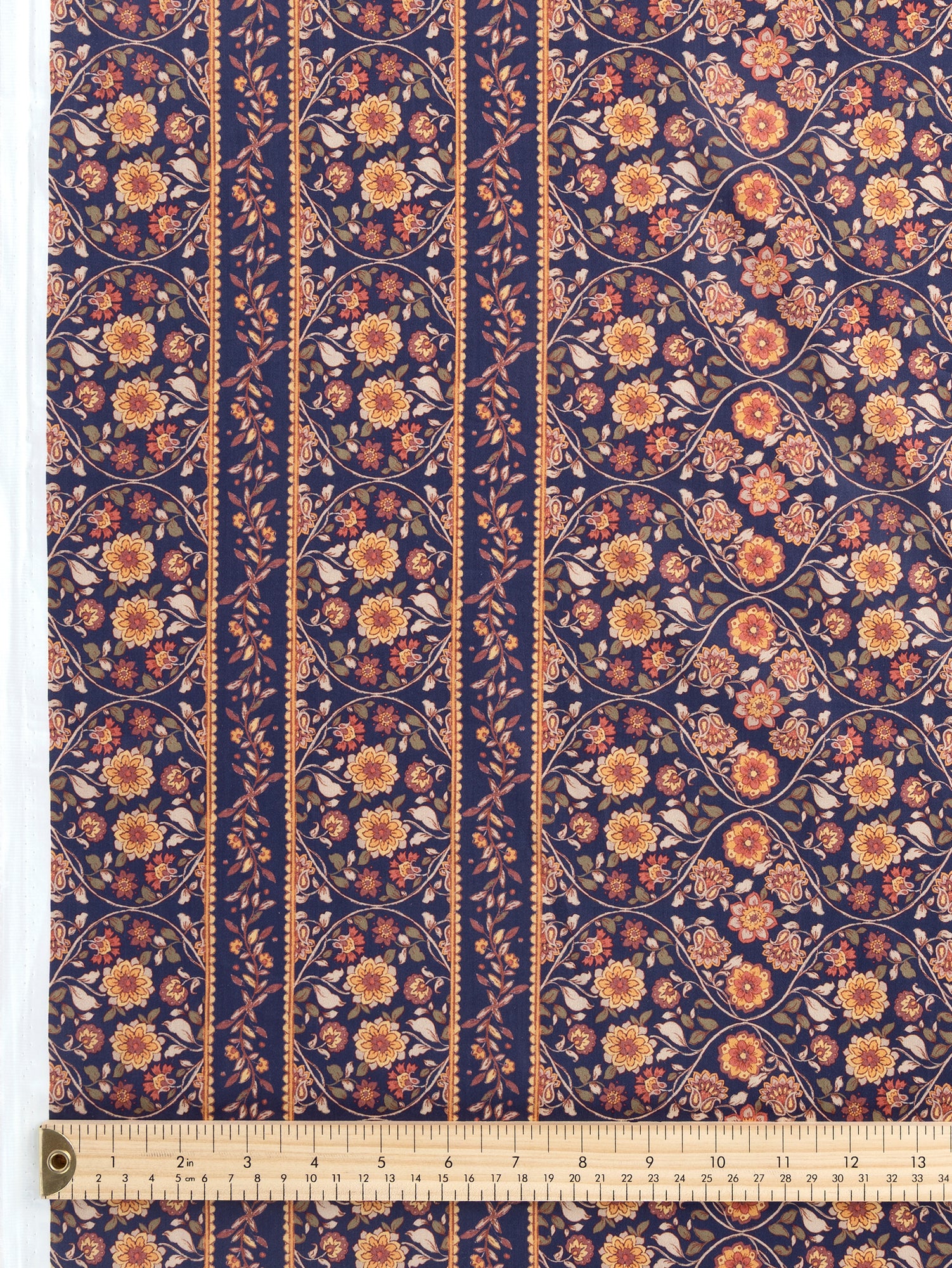 F-COT389-Floral-Trellis-Border-Print-Cotton-Lawn-Indigo-Terracotta-and-Olive-Core-Fabrics-ruler-closeup.JPG